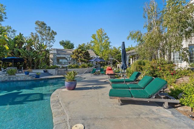 a childrens park with lots of swings and slides