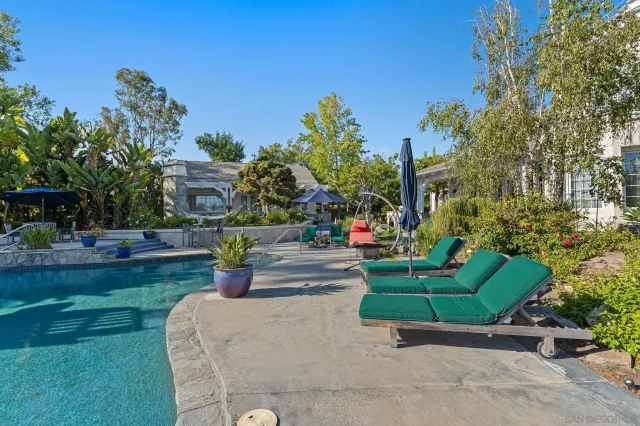 a childrens park with lots of swings and slides