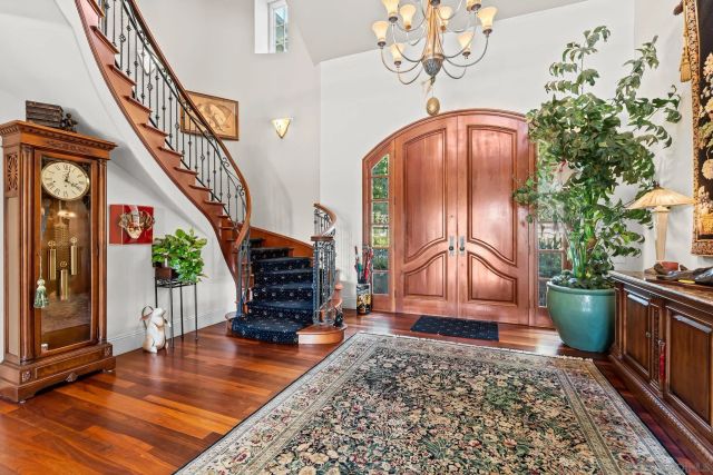 a view of an entryway with wooden floor