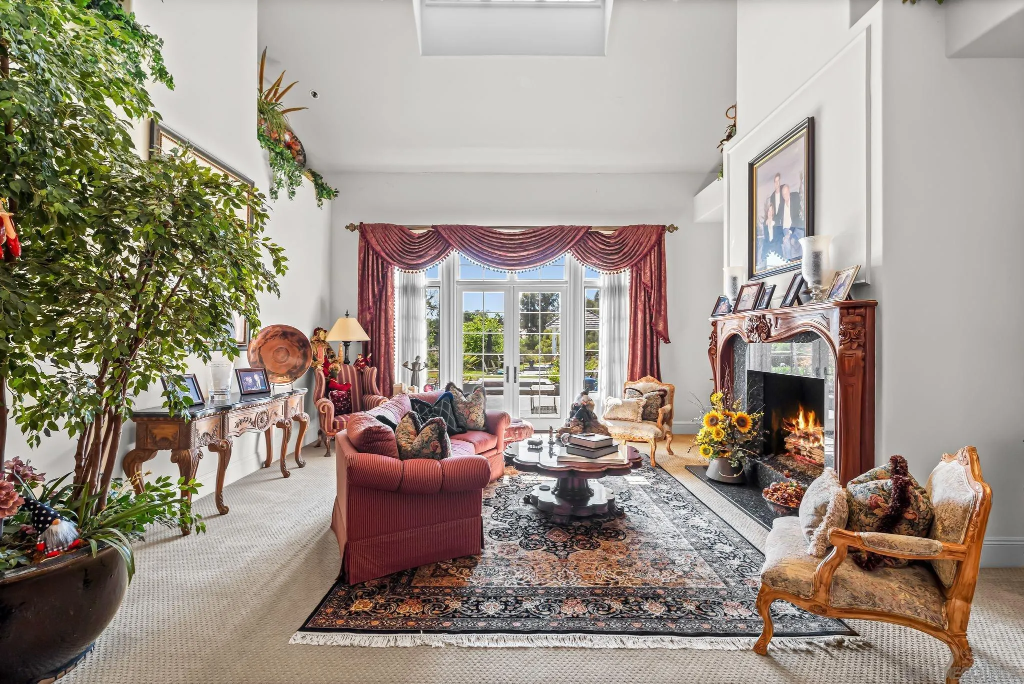 14786 Rancho Santa Fe Farms Road Rancho Santa Fe, CA 92067 - Photo 9 of 49 a living room with furniture fireplace and a large window