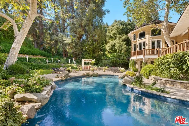 a view of a swimming pool with a patio