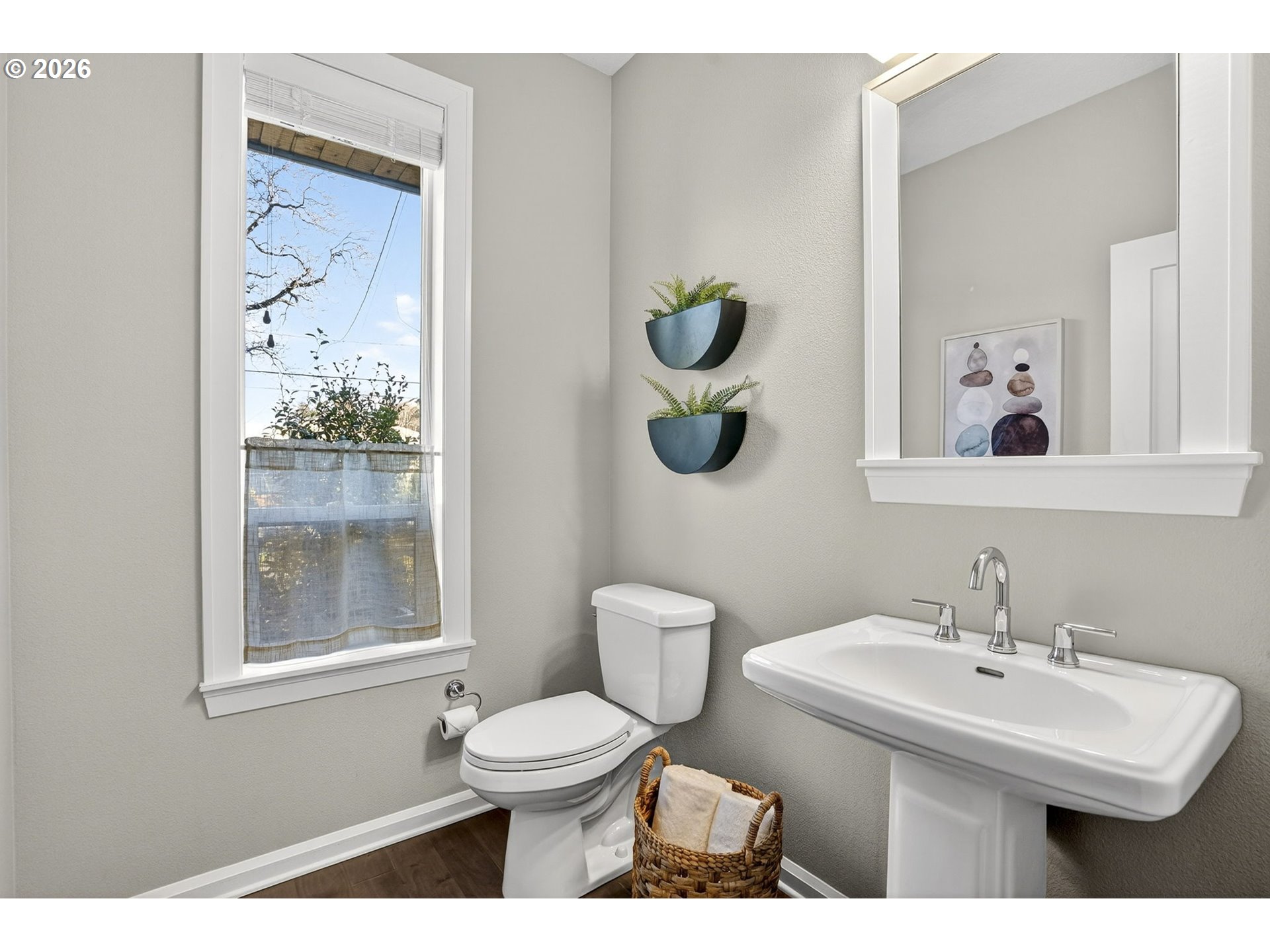 6123 Northeast 34th Avenue Portland, OR 97211 - Photo 20 of 42 a bathroom with a toilet a sink and mirror