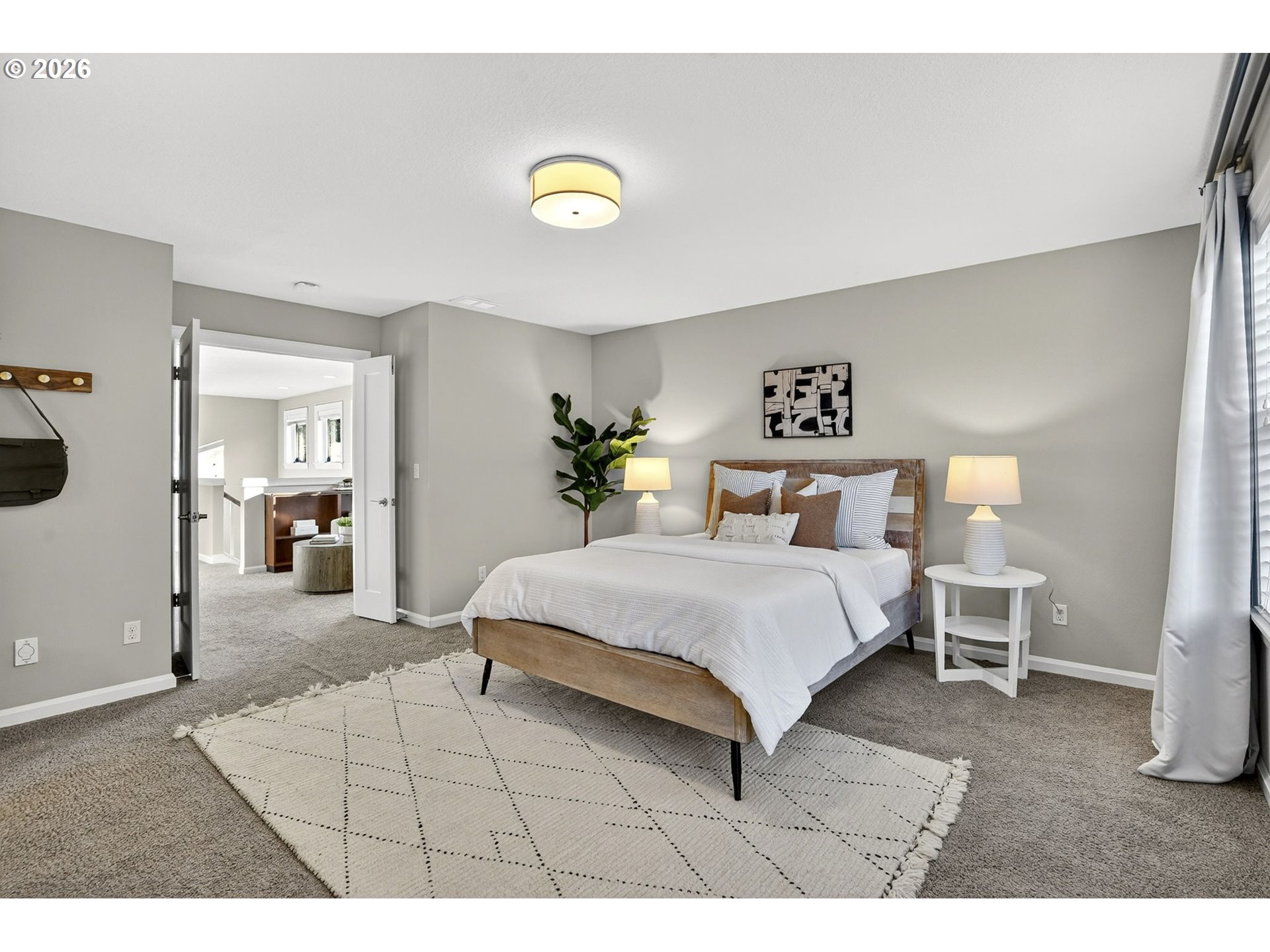 6123 Northeast 34th Avenue Portland, OR 97211 - Photo 25 of 42 a bedroom with a bed and lamp