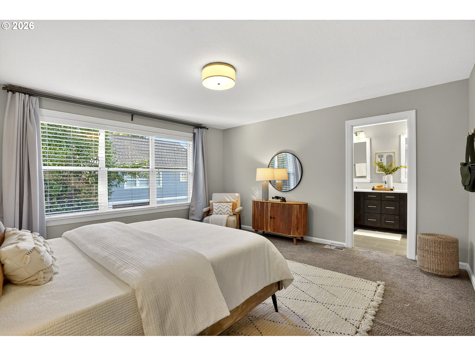 6123 Northeast 34th Avenue Portland, OR 97211 - Photo 27 of 42 a bedroom with a bed and a large window