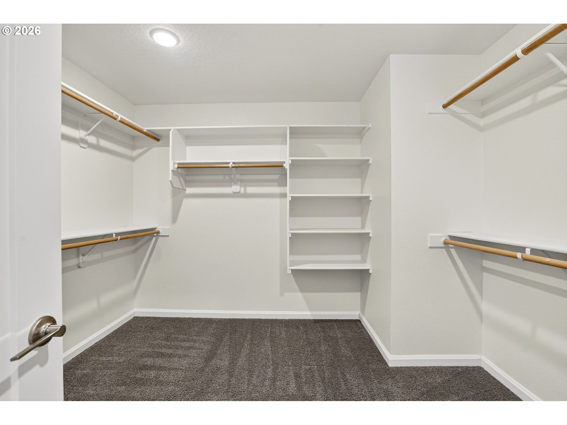 6123 Northeast 34th Avenue Portland, OR 97211 - Photo 30 of 42 a view of walk in closet with empty racks