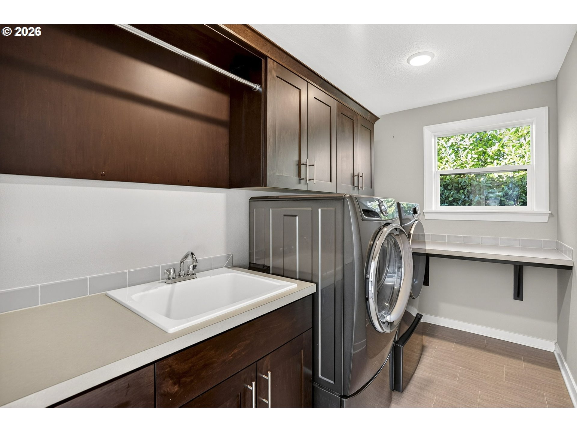6123 Northeast 34th Avenue Portland, OR 97211 - Photo 36 of 42 a utility room with sink dryer and washer