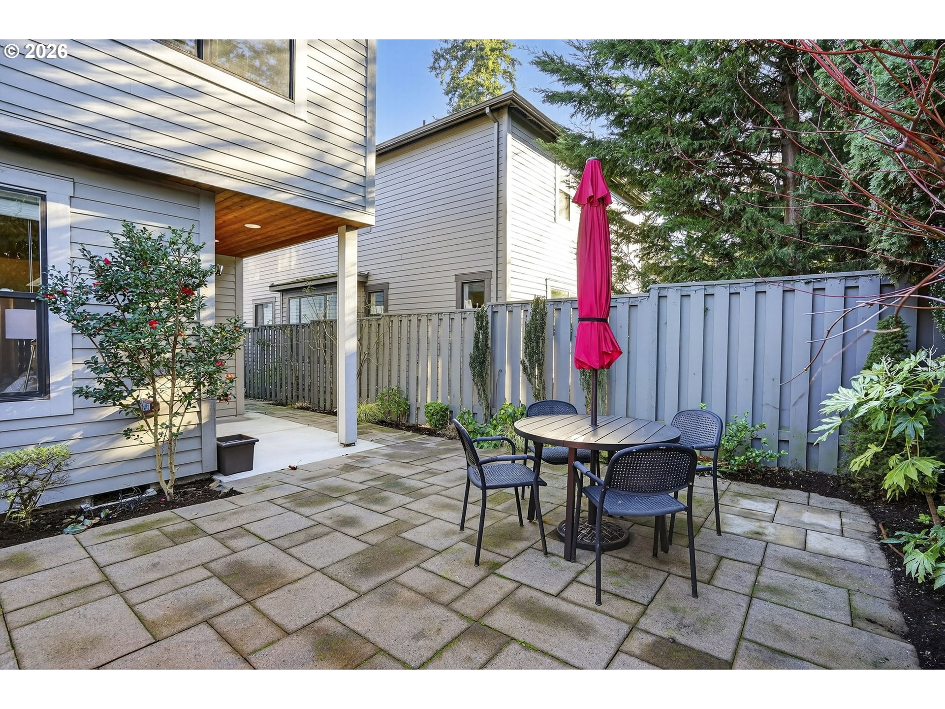 6123 Northeast 34th Avenue Portland, OR 97211 - Photo 39 of 42 a view of a table and chairs in backyard of the house