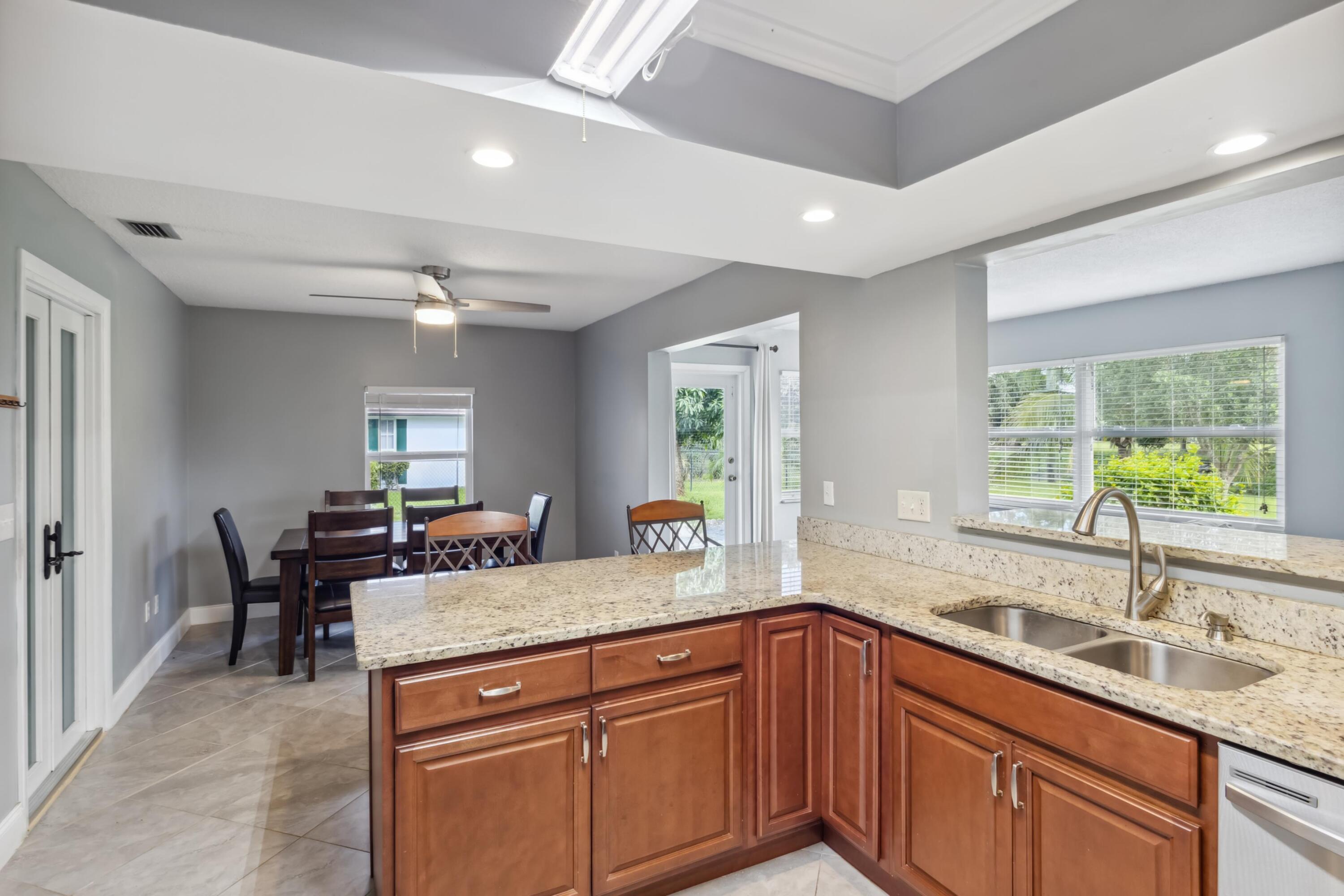 1536 Southeast Sunshine Avenue Port St. Lucie, FL 34952 - Photo 4 of 18 a kitchen with sink and window