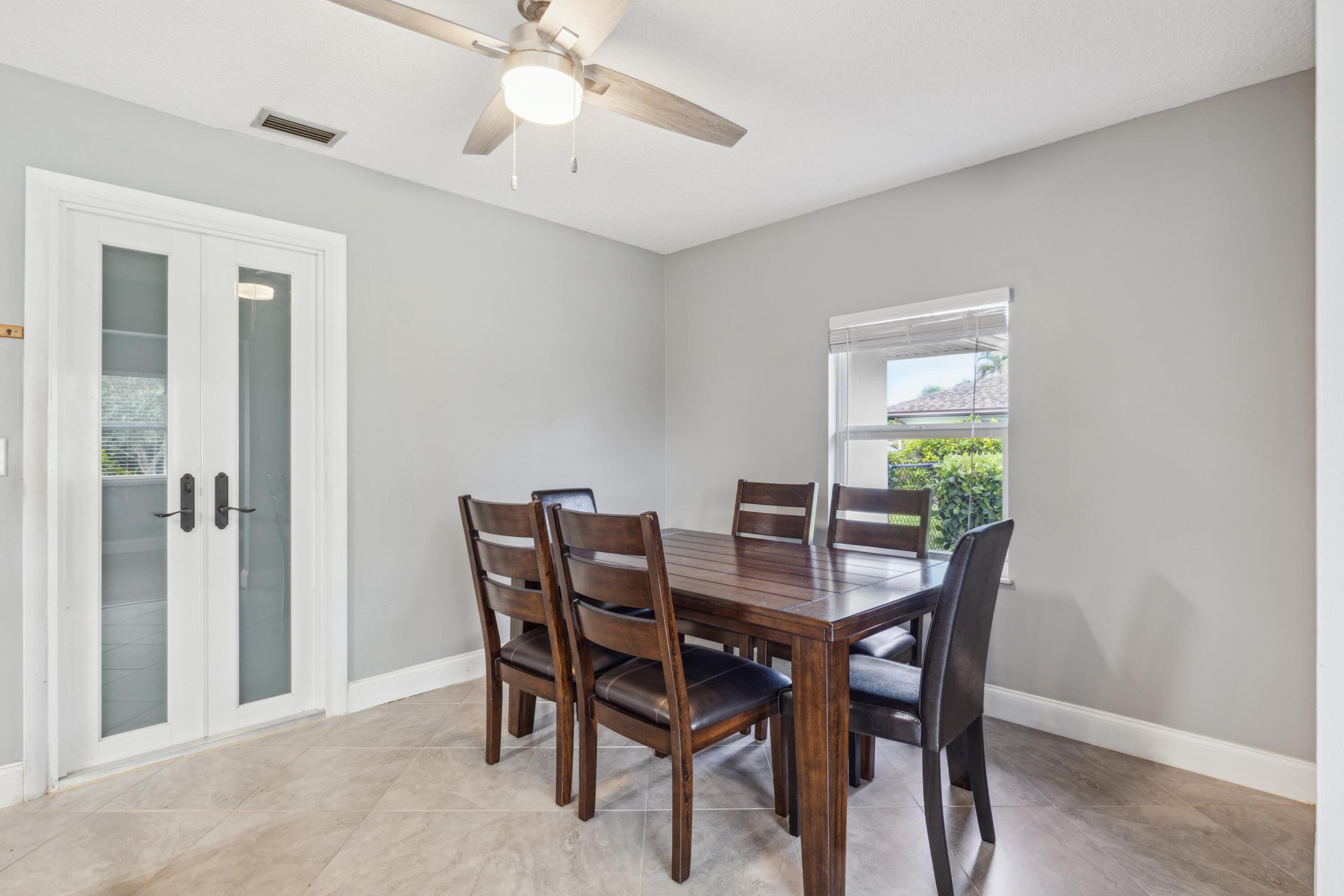 1536 Southeast Sunshine Avenue Port St. Lucie, FL 34952 - Photo 5 of 18 a view of a dining room with furniture