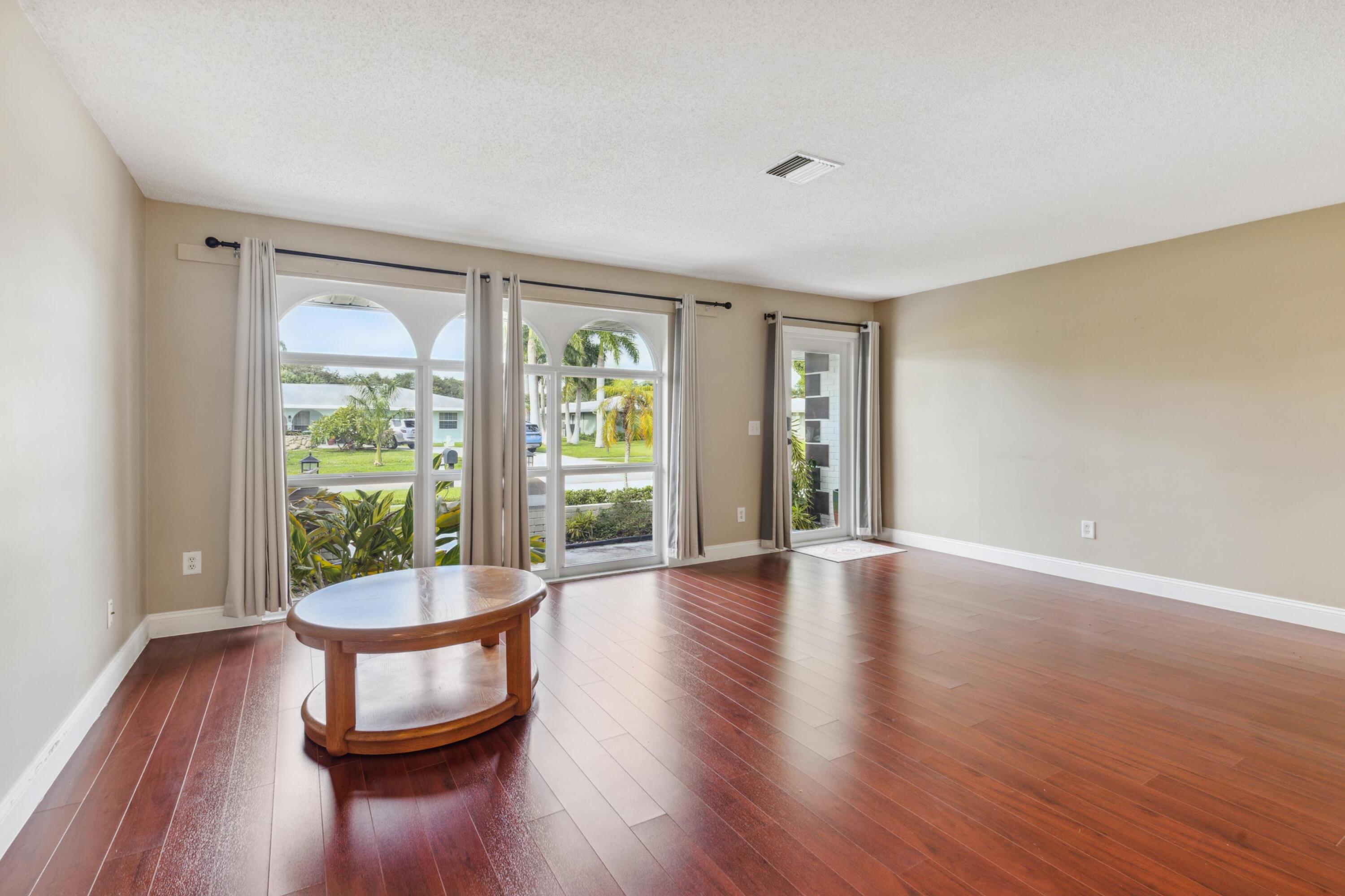 1536 Southeast Sunshine Avenue Port St. Lucie, FL 34952 - Photo 6 of 18 a living room with furniture and a window