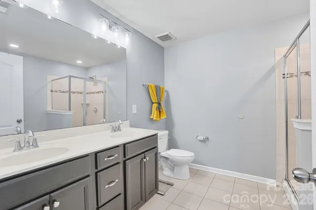 a white bath tub sitting next to a shower