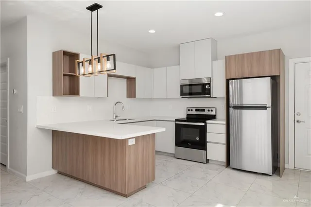 an empty room with a ceiling fan and window