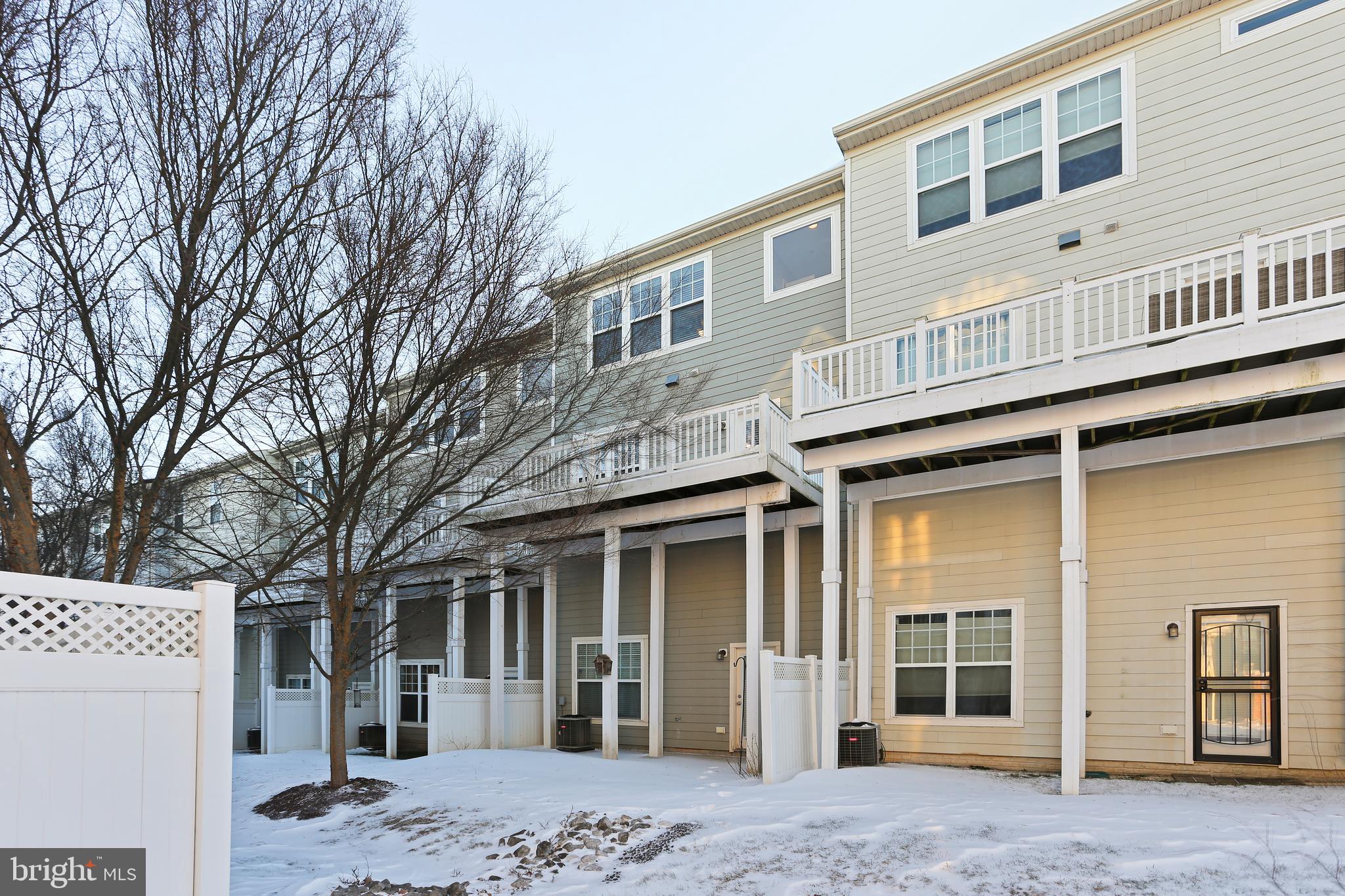 2719 Amber Crest Road Hanover, MD 21076 - Photo 17 of 22 a front view of a building with a outdoor space
