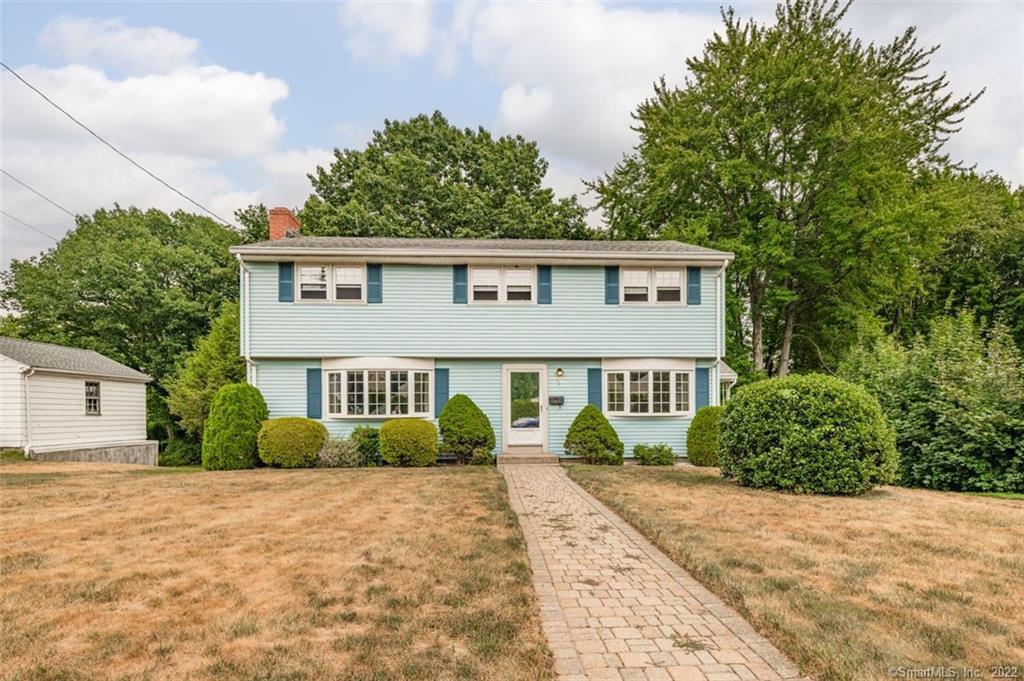 72 Marlin Road New Britain, CT 06053 - Photo 1 of 1 a front view of a house with a garden