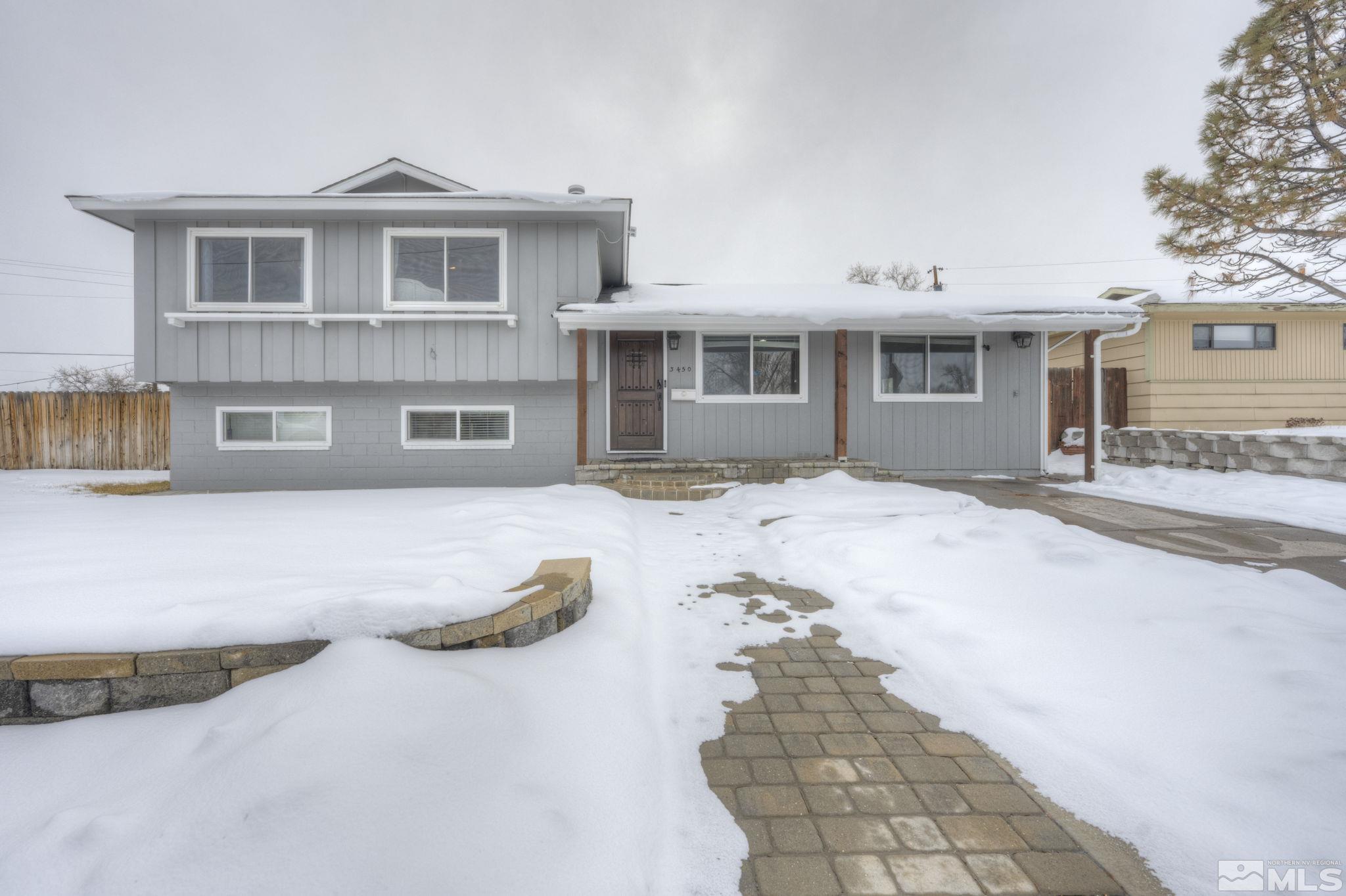 3450 West 7th Street Reno, NV 89503 - Photo 1 of 40 a front view of a house with a yard