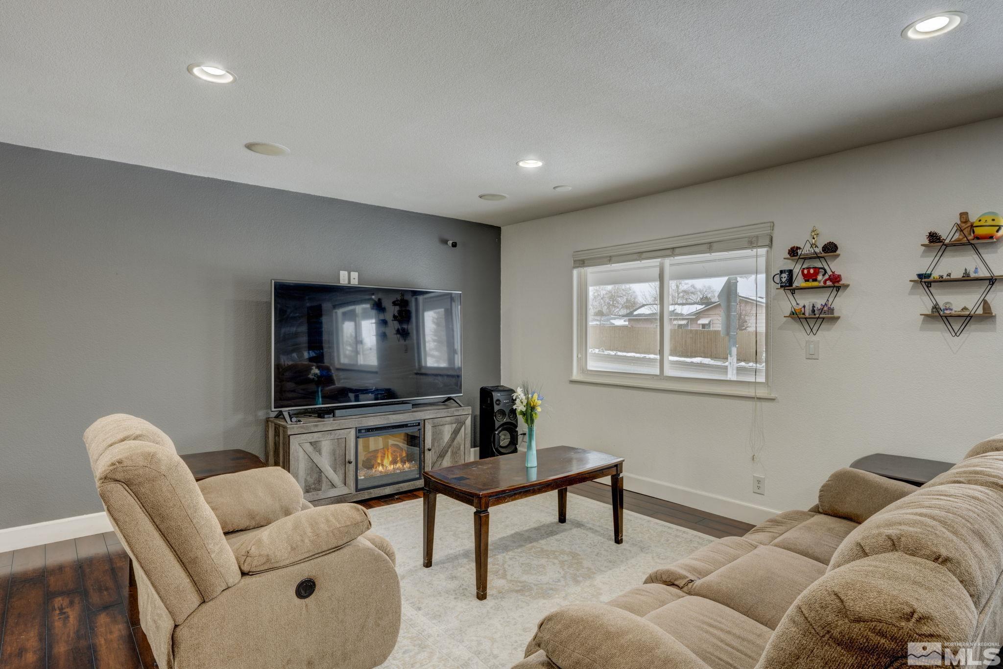 3450 West 7th Street Reno, NV 89503 - Photo 17 of 40 a living room with furniture and a flat screen tv