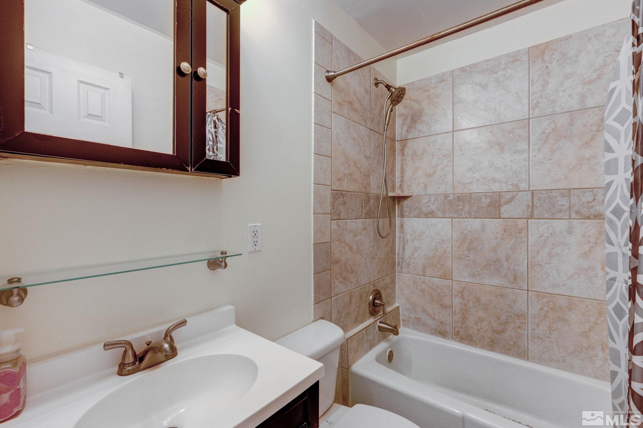 3450 West 7th Street Reno, NV 89503 - Photo 25 of 40 a bathroom with a sink and a bathtub