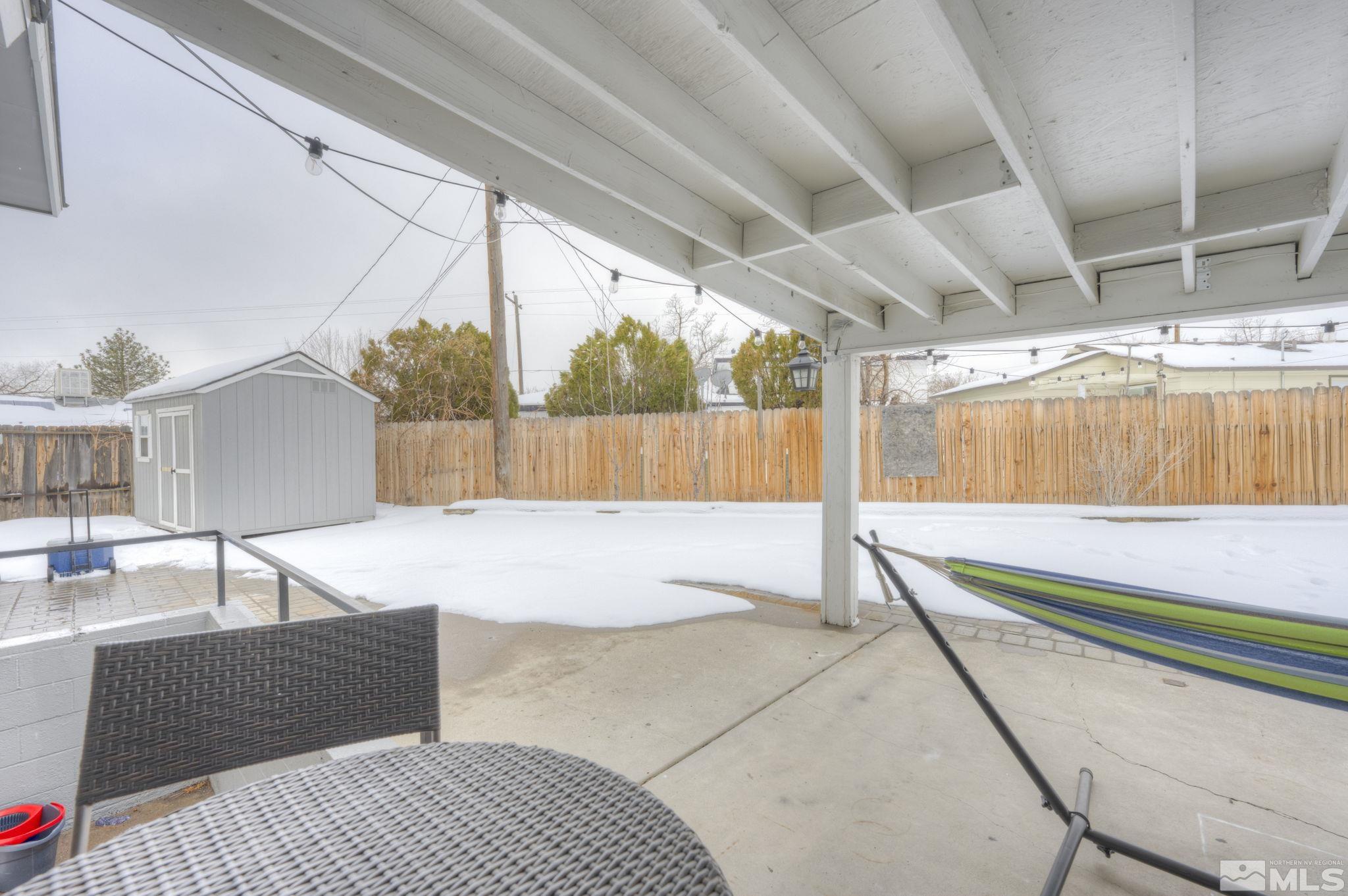 3450 West 7th Street Reno, NV 89503 - Photo 10 of 40 a swimming pool with a couch and wooden fence