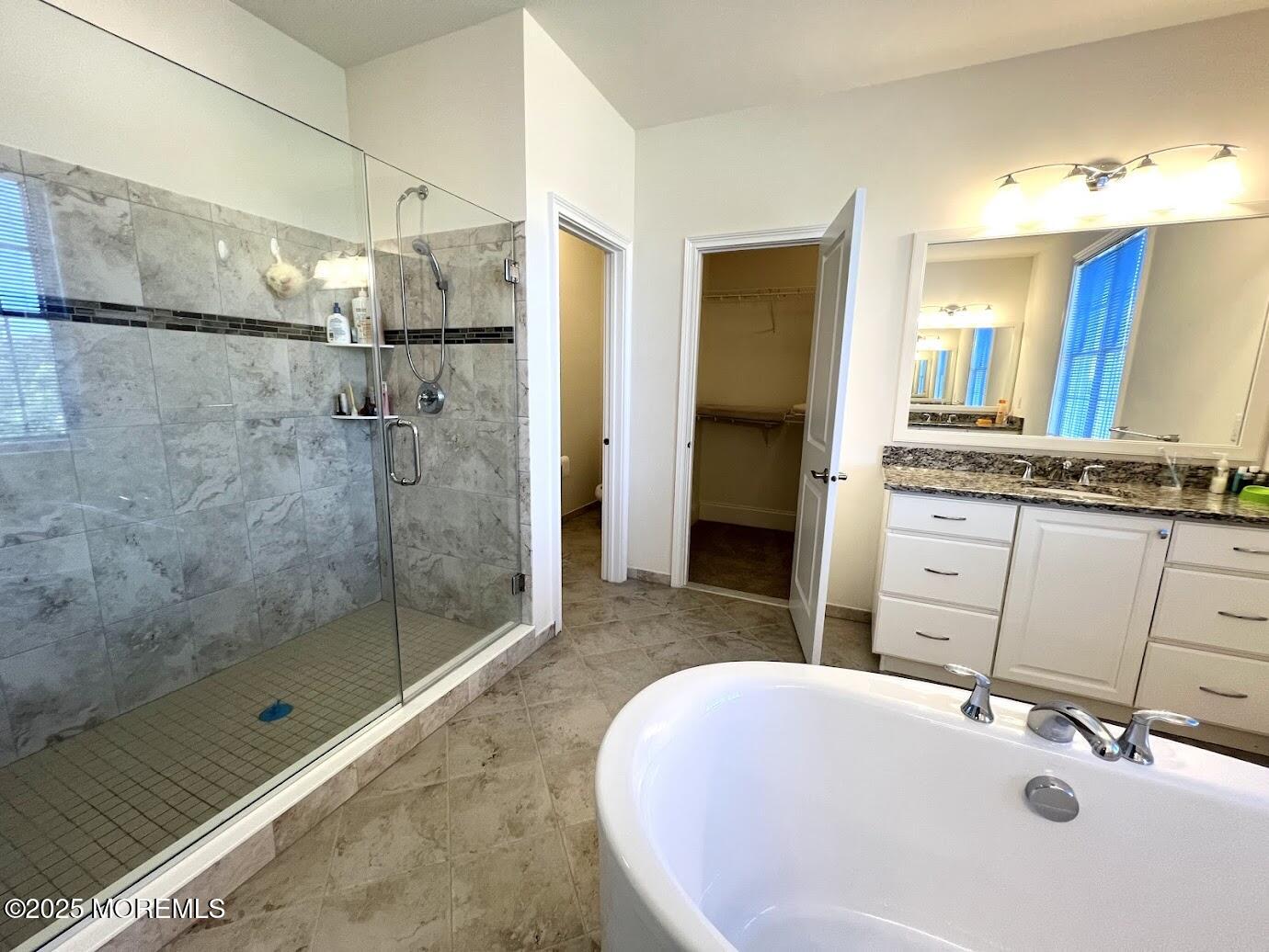 16 Exeter Way Holmdel, NJ 07733 - Photo 32 of 57 a bathroom with a sink and a mirror