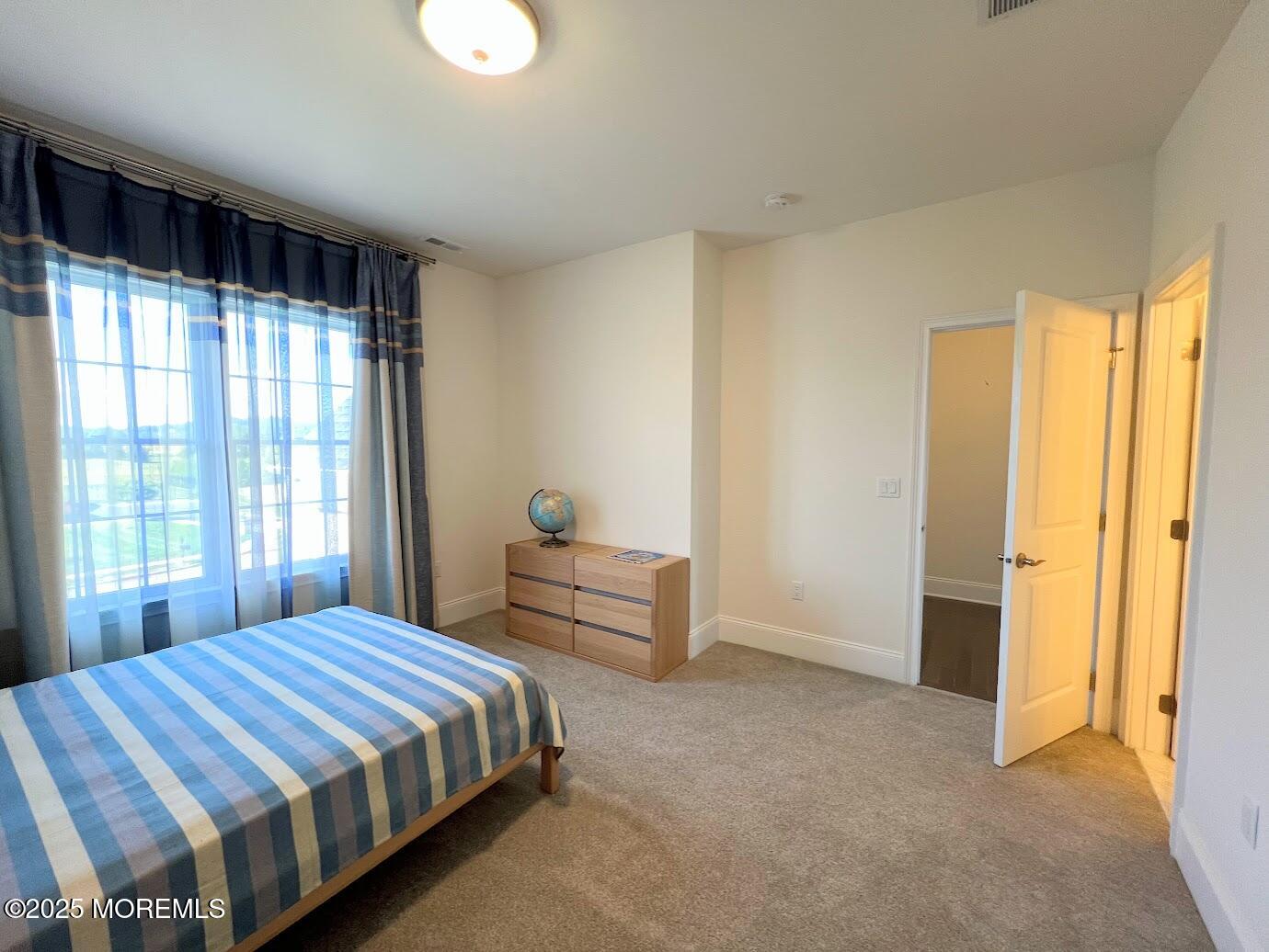 16 Exeter Way Holmdel, NJ 07733 - Photo 34 of 57 a bedroom with a bed and wooden floor