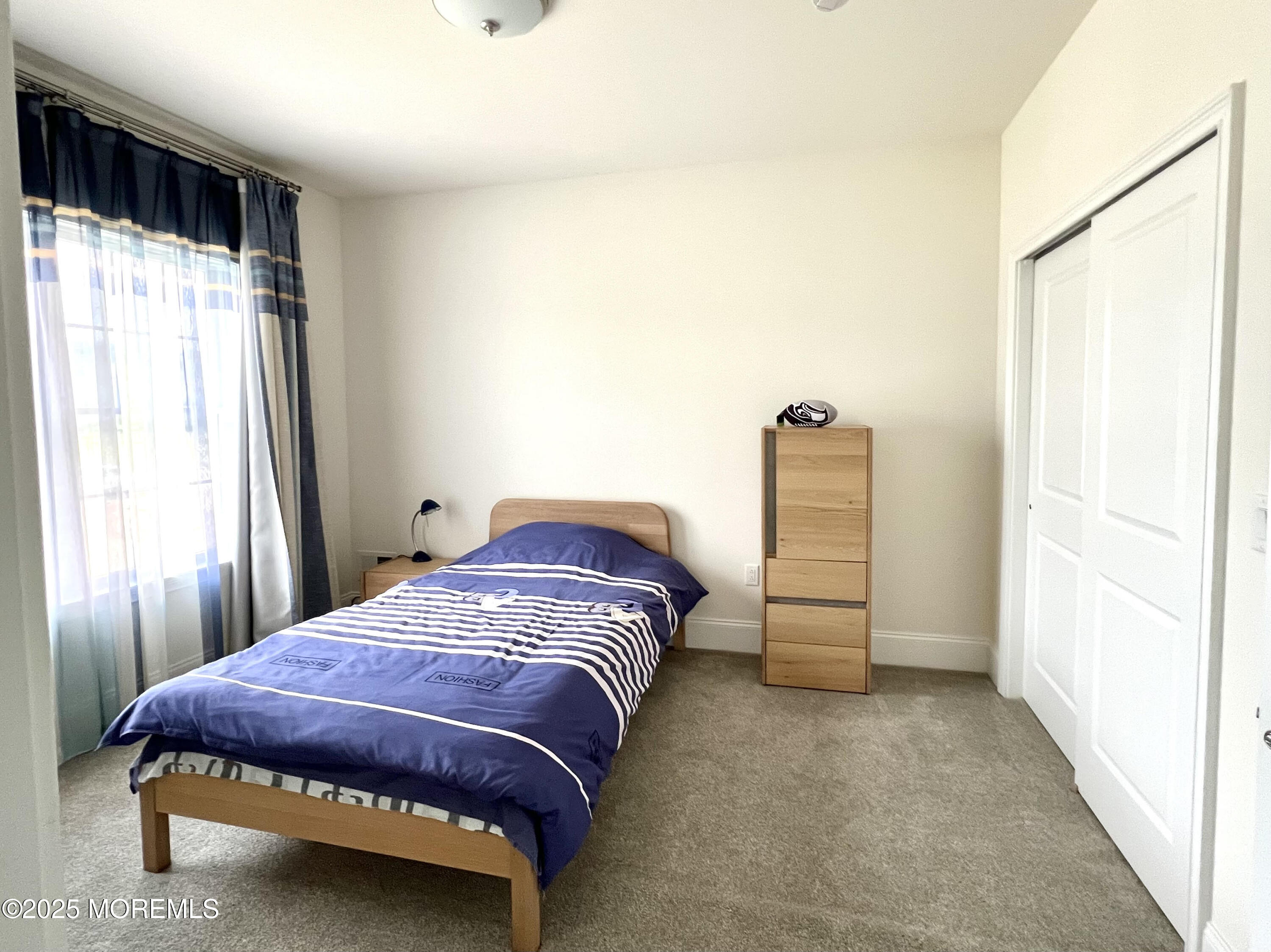 16 Exeter Way Holmdel, NJ 07733 - Photo 38 of 57 a bedroom with a bed and a cabinets