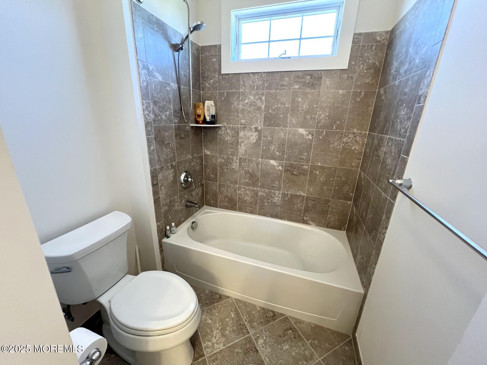 16 Exeter Way Holmdel, NJ 07733 - Photo 43 of 57 a white bath tub sitting next to a white toilet