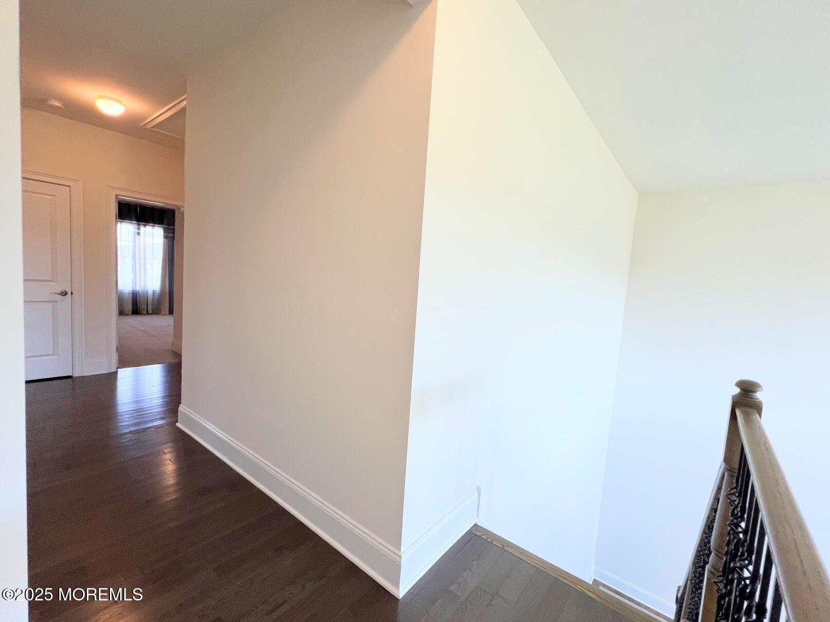 16 Exeter Way Holmdel, NJ 07733 - Photo 44 of 57 a view of a hallway with wooden floor