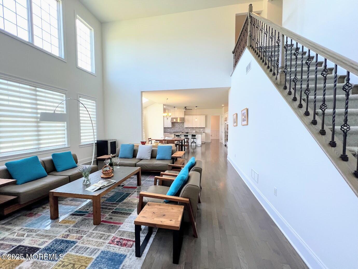 16 Exeter Way Holmdel, NJ 07733 - Photo 45 of 57 a living room with furniture wooden floor and a large window