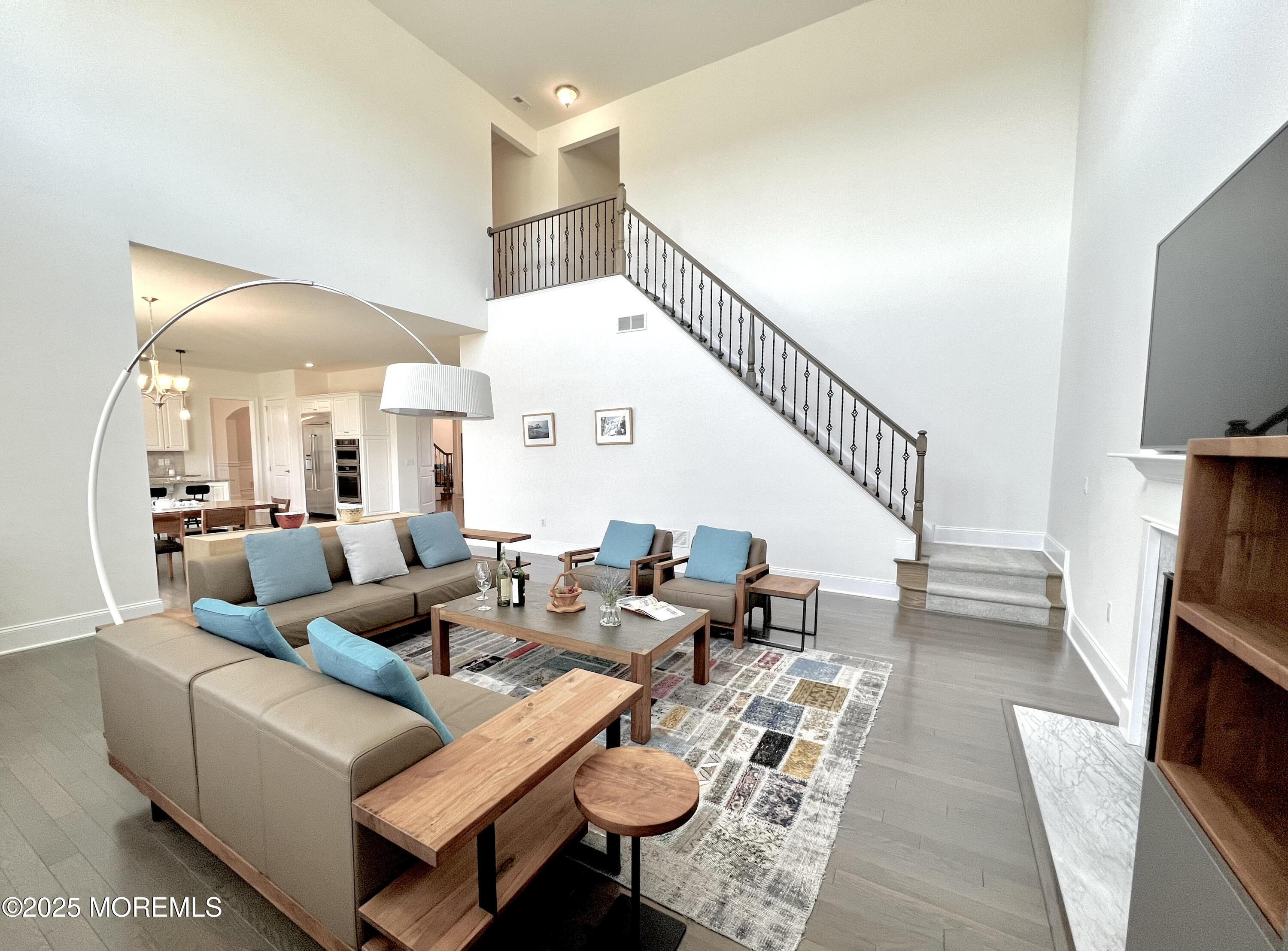 16 Exeter Way Holmdel, NJ 07733 - Photo 46 of 57 a living room with fireplace furniture and a flat screen tv