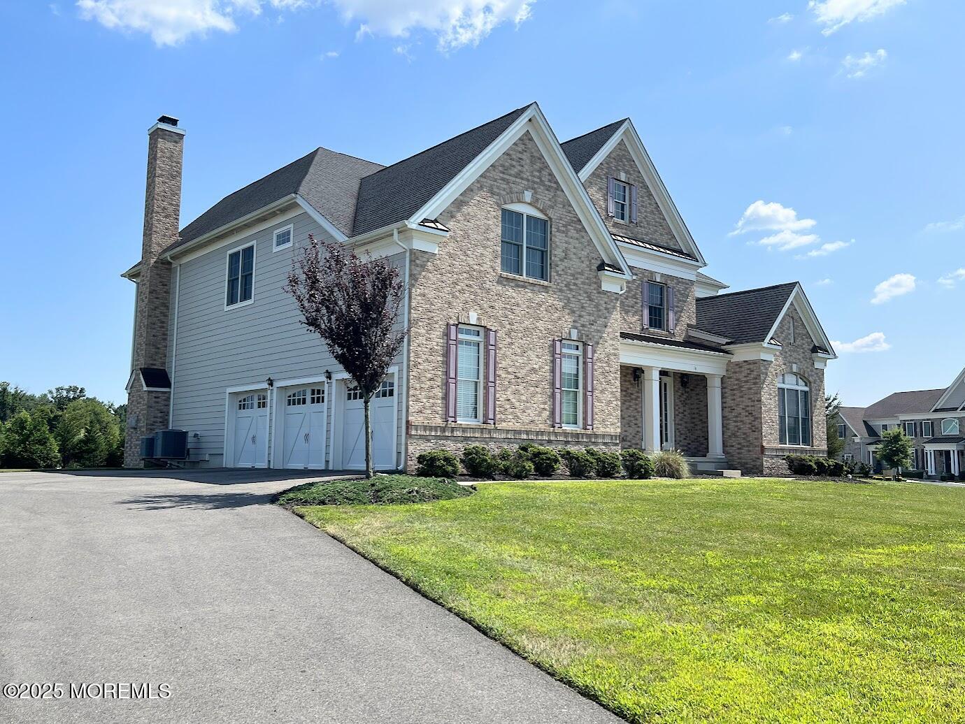 16 Exeter Way Holmdel, NJ 07733 - Photo 48 of 57 a front view of a house with a yard