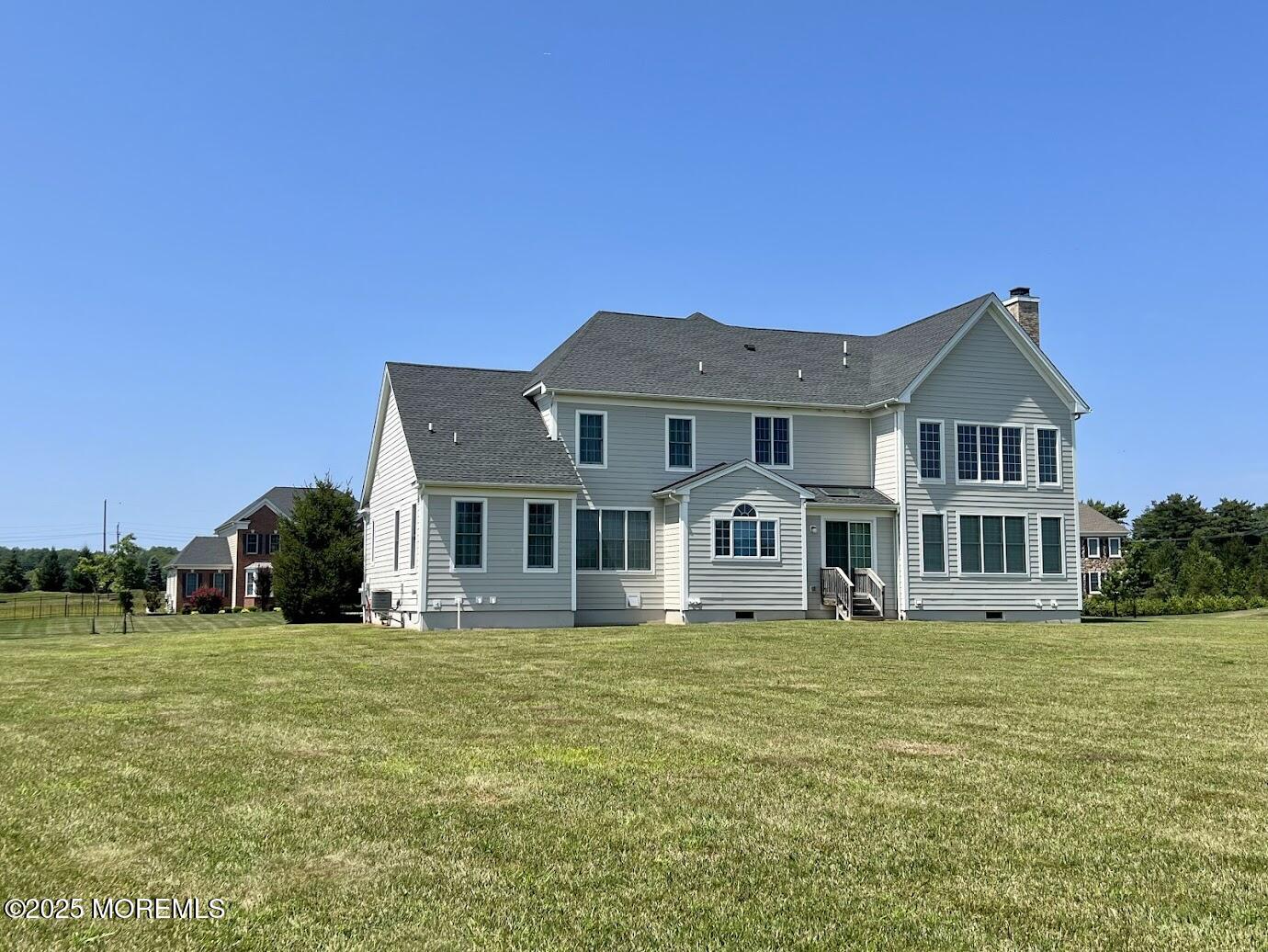 16 Exeter Way Holmdel, NJ 07733 - Photo 49 of 57 a front view of a house with a garden