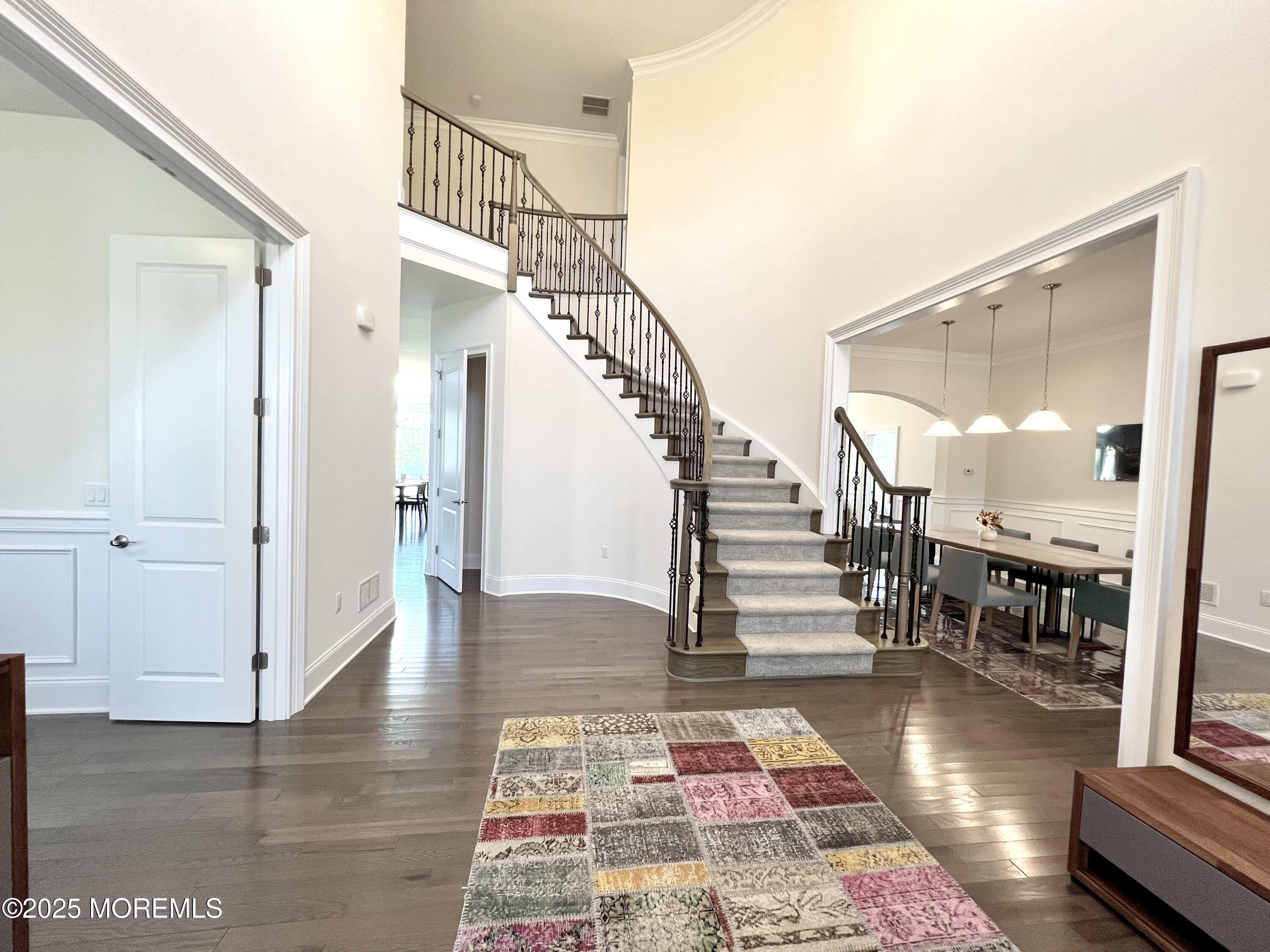 16 Exeter Way Holmdel, NJ 07733 - Photo 7 of 57 a view of entryway and hall with wooden floor