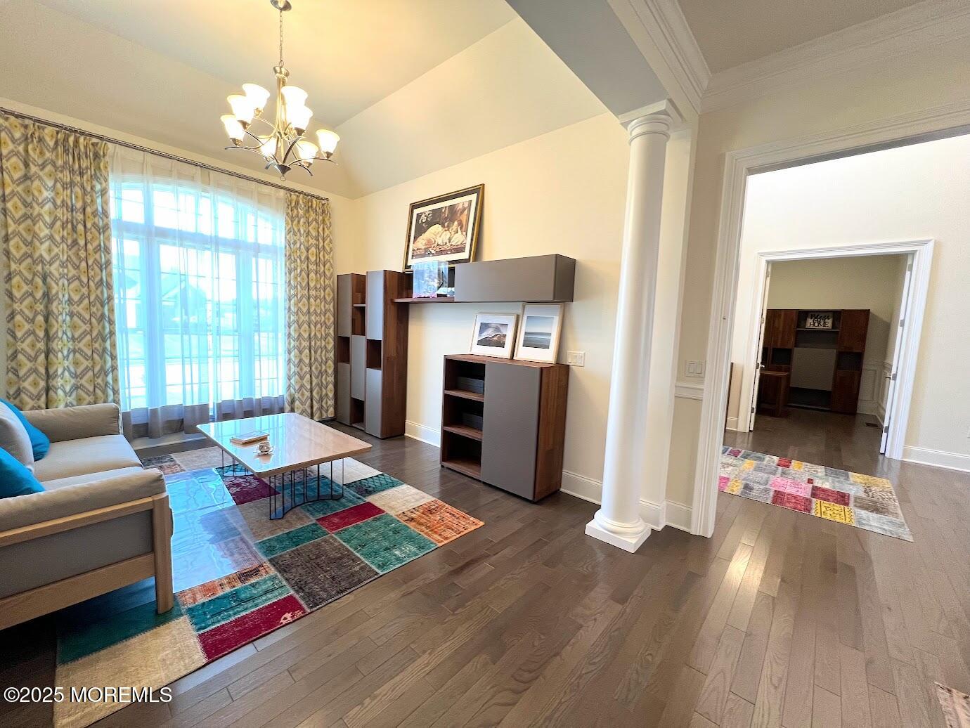 16 Exeter Way Holmdel, NJ 07733 - Photo 8 of 57 a living room with furniture and a chandelier