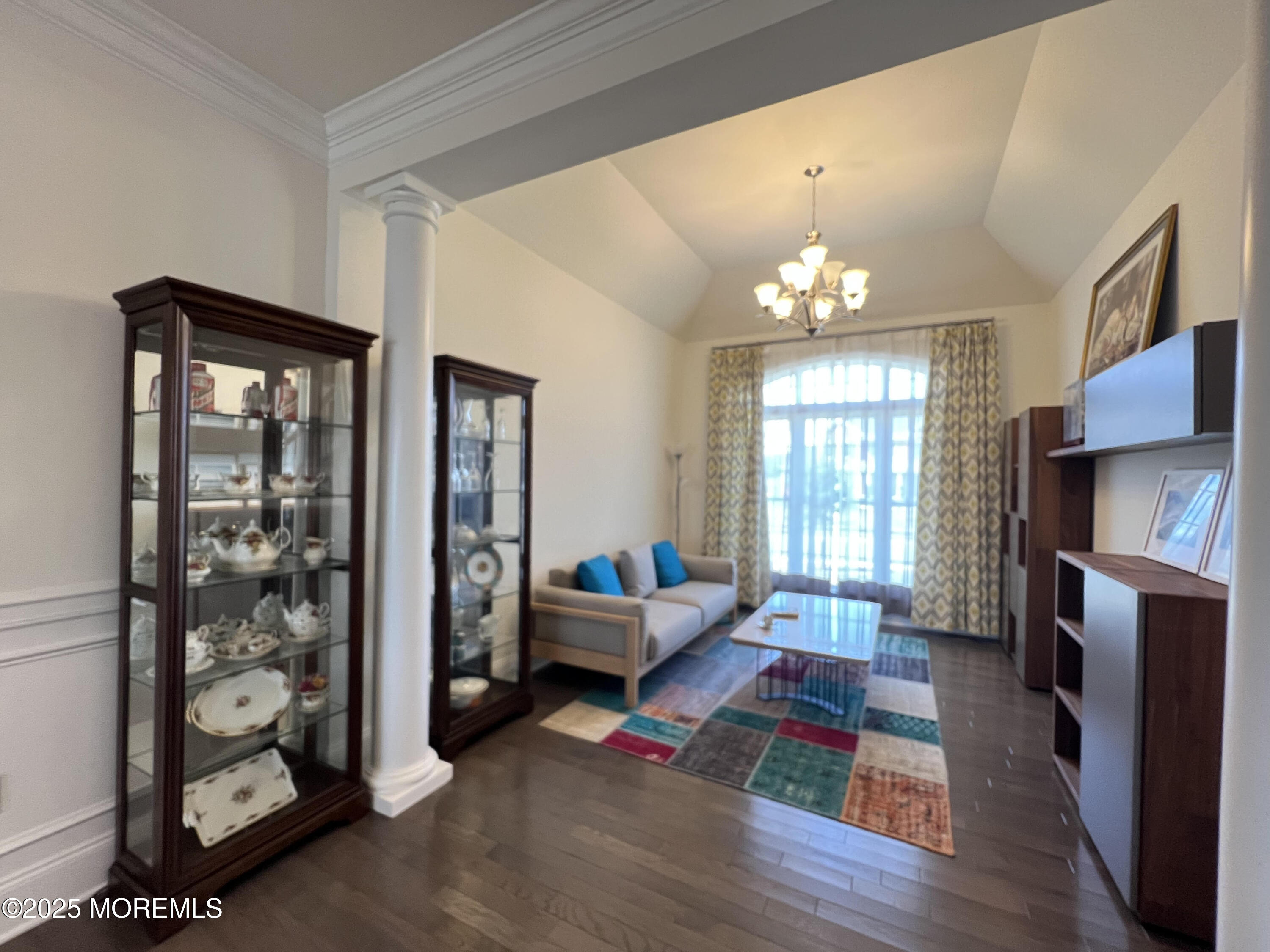 16 Exeter Way Holmdel, NJ 07733 - Photo 9 of 57 a living room with furniture and a chandelier