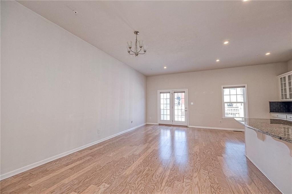 527-529 Tuscarora Road Mars, PA 16046 - Photo 9 of 38 a view of an empty room with a window and wooden floor