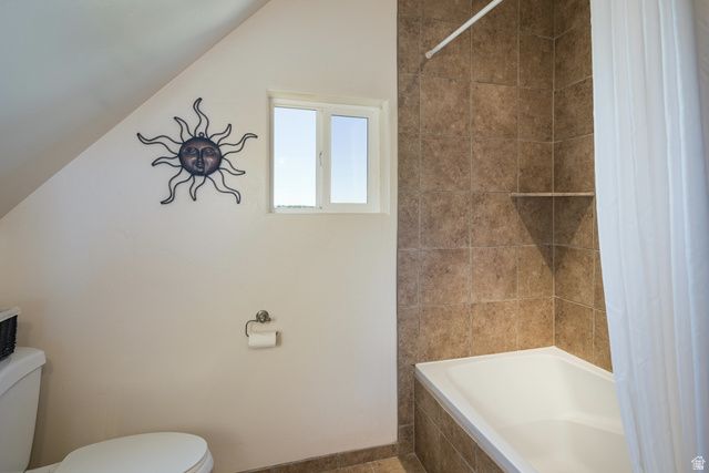 684 Blue Mountain Ridge Monticello, UT 84535 - Photo 52 of 71 Bathroom with tiled shower / bath and lofted ceiling