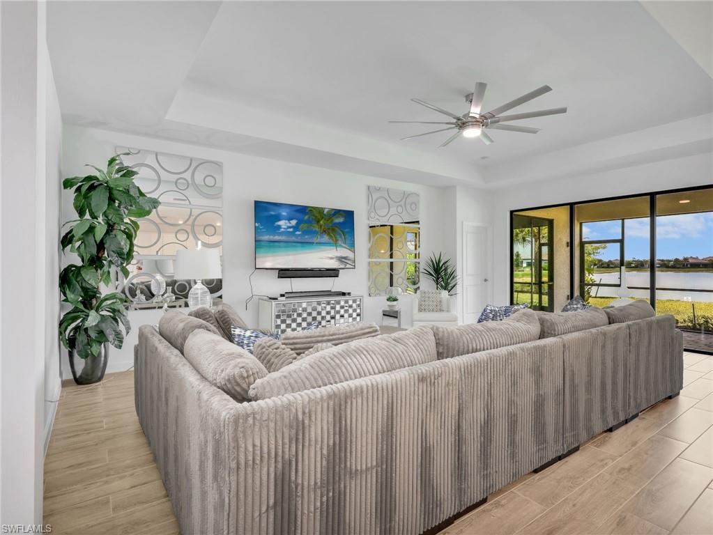 18278 Ridgeline Drive Estero, FL 33928 - Photo 14 of 45 a living room with furniture and a large window