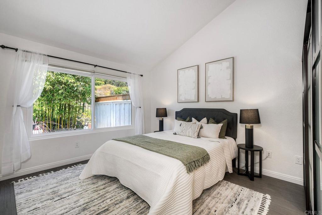 4710 Majorca Way Oceanside, CA 92056 - Photo 19 of 42 The primary bedroom has a lovely view of the backyard patio.