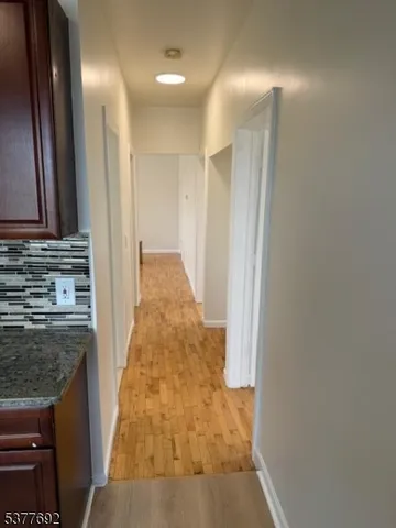 a view of a kitchen from the hallway