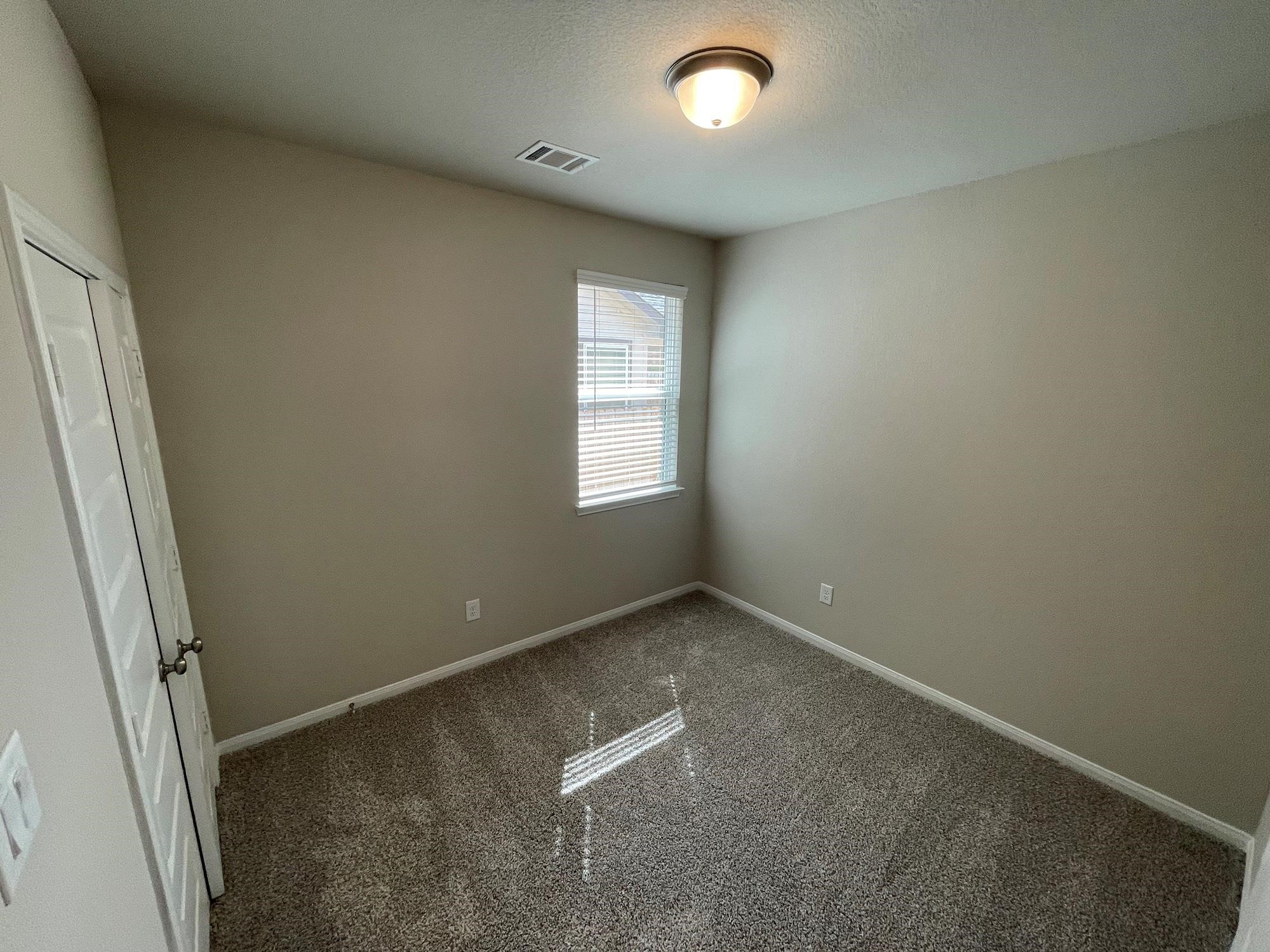 2035 Myrtle Oak Street Conroe, TX 77304 - Photo 11 of 20 an empty room with windows