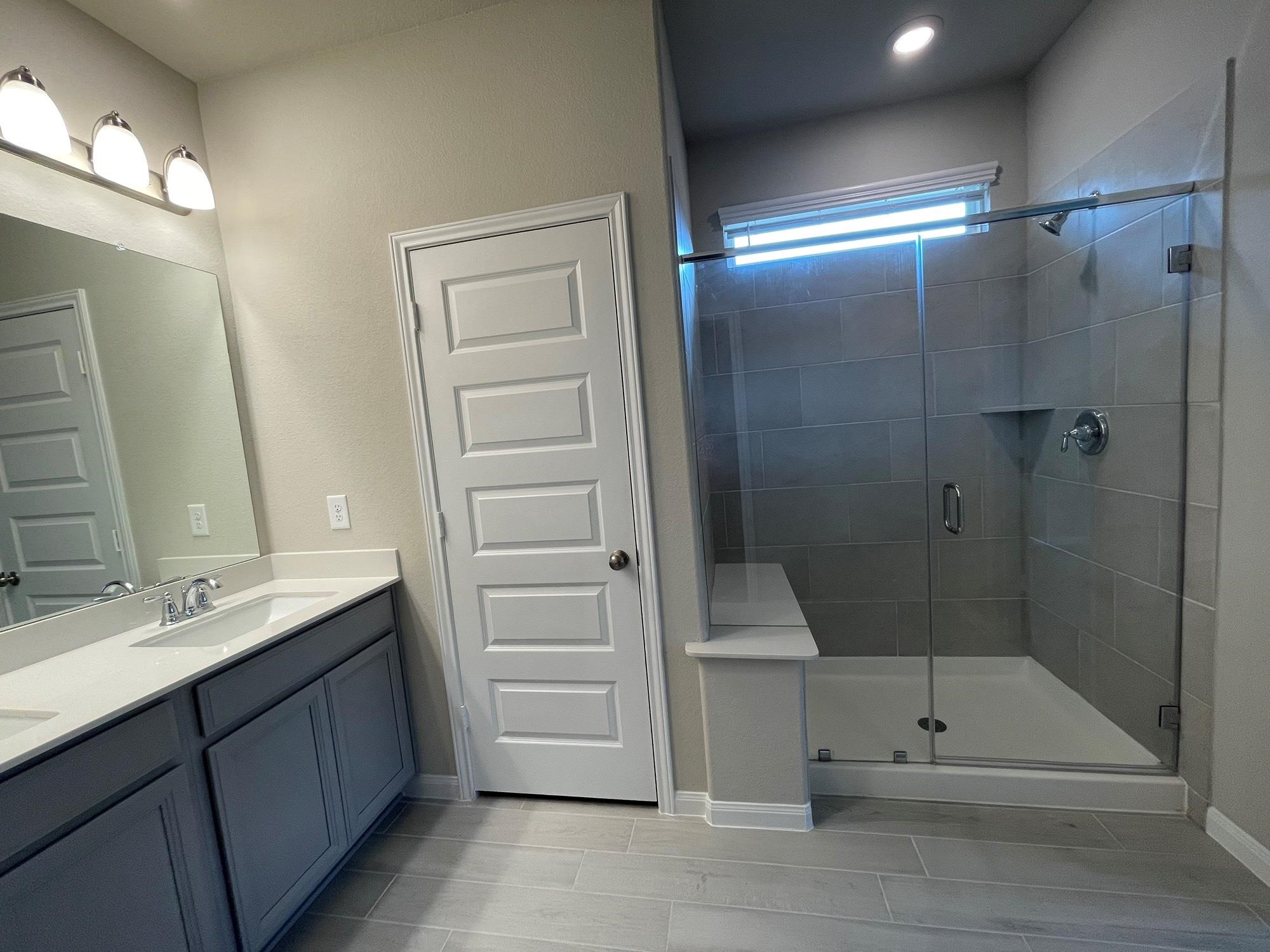 2035 Myrtle Oak Street Conroe, TX 77304 - Photo 15 of 20 a bathroom with a shower and a sink
