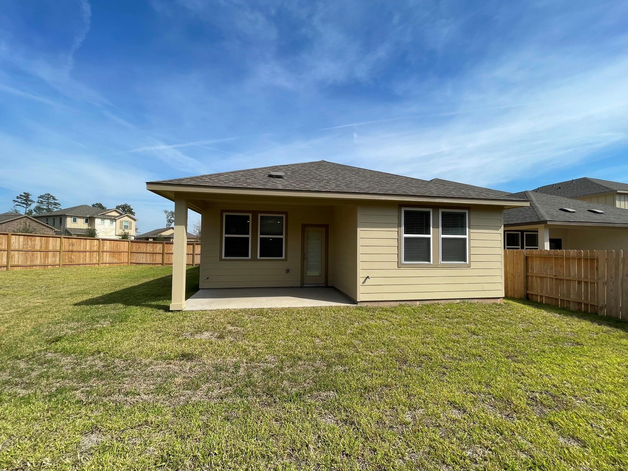 2035 Myrtle Oak Street Conroe, TX 77304 - Photo 17 of 20 a view of a house with backyard porch and garden