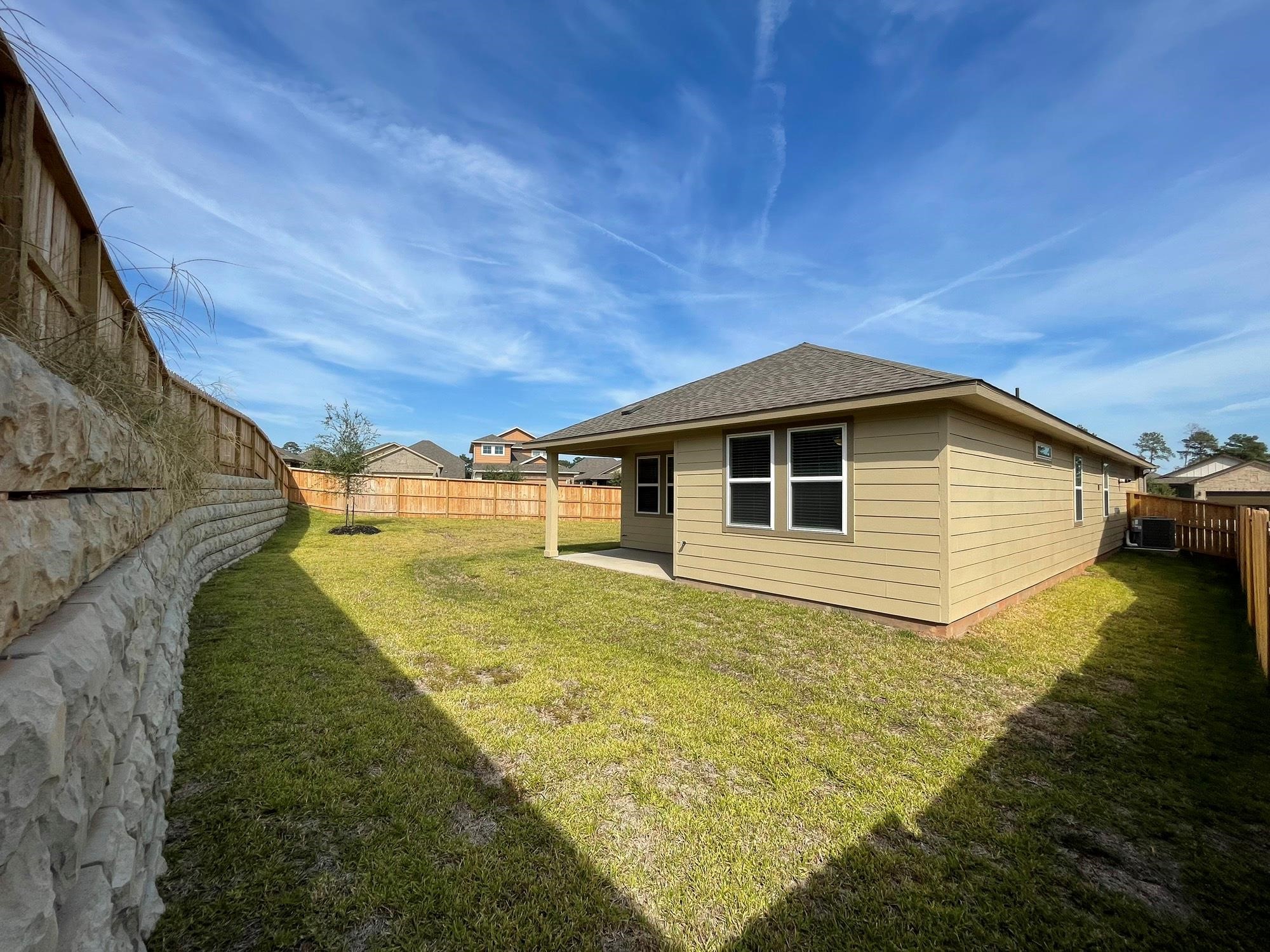 2035 Myrtle Oak Street Conroe, TX 77304 - Photo 20 of 20 a view of a house with a yard