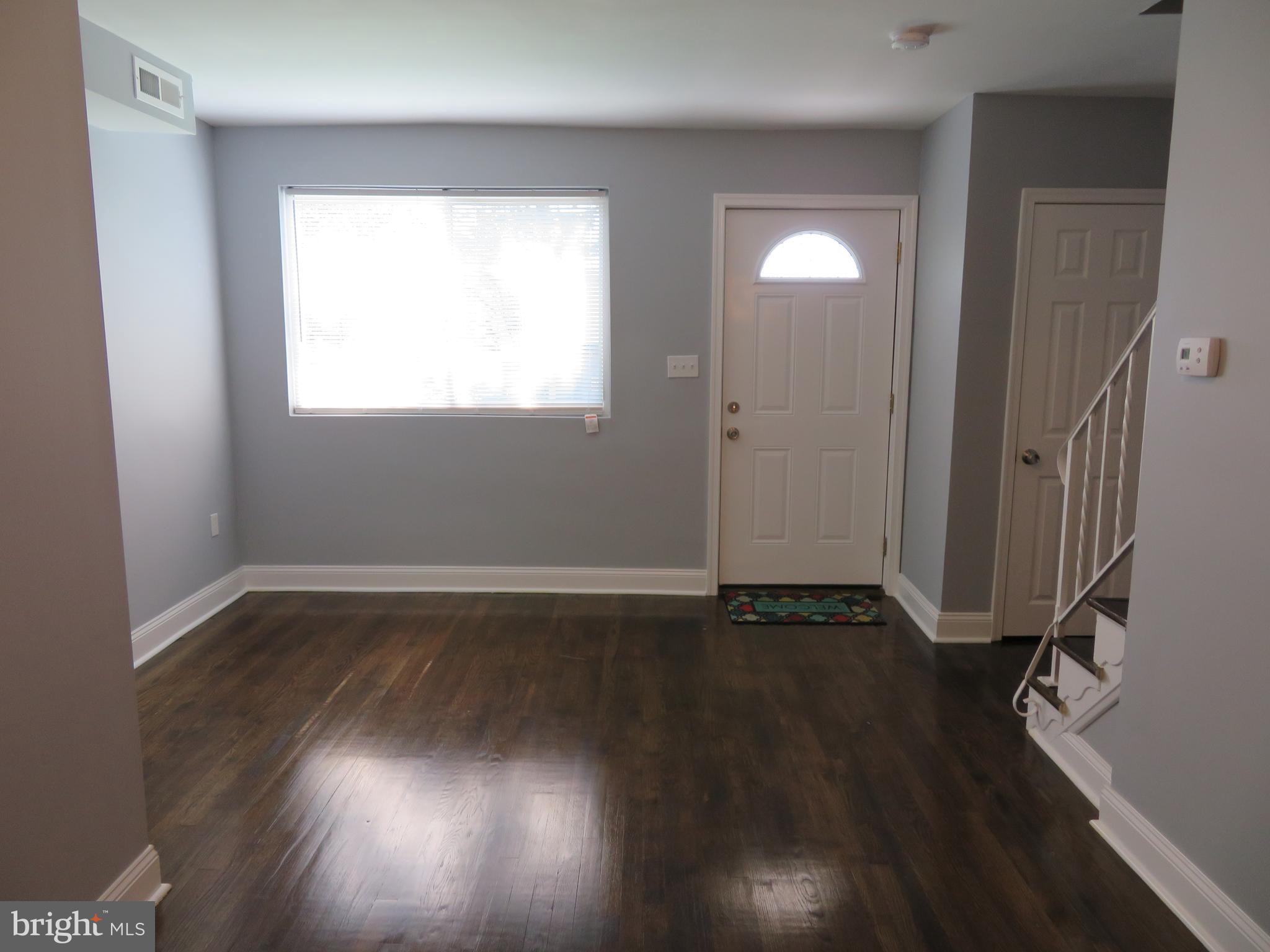 4005 Pimlico Road Baltimore, MD 21215 - Photo 21 of 45 Living Room with Coat Closet and stairs to 2nd Lvl