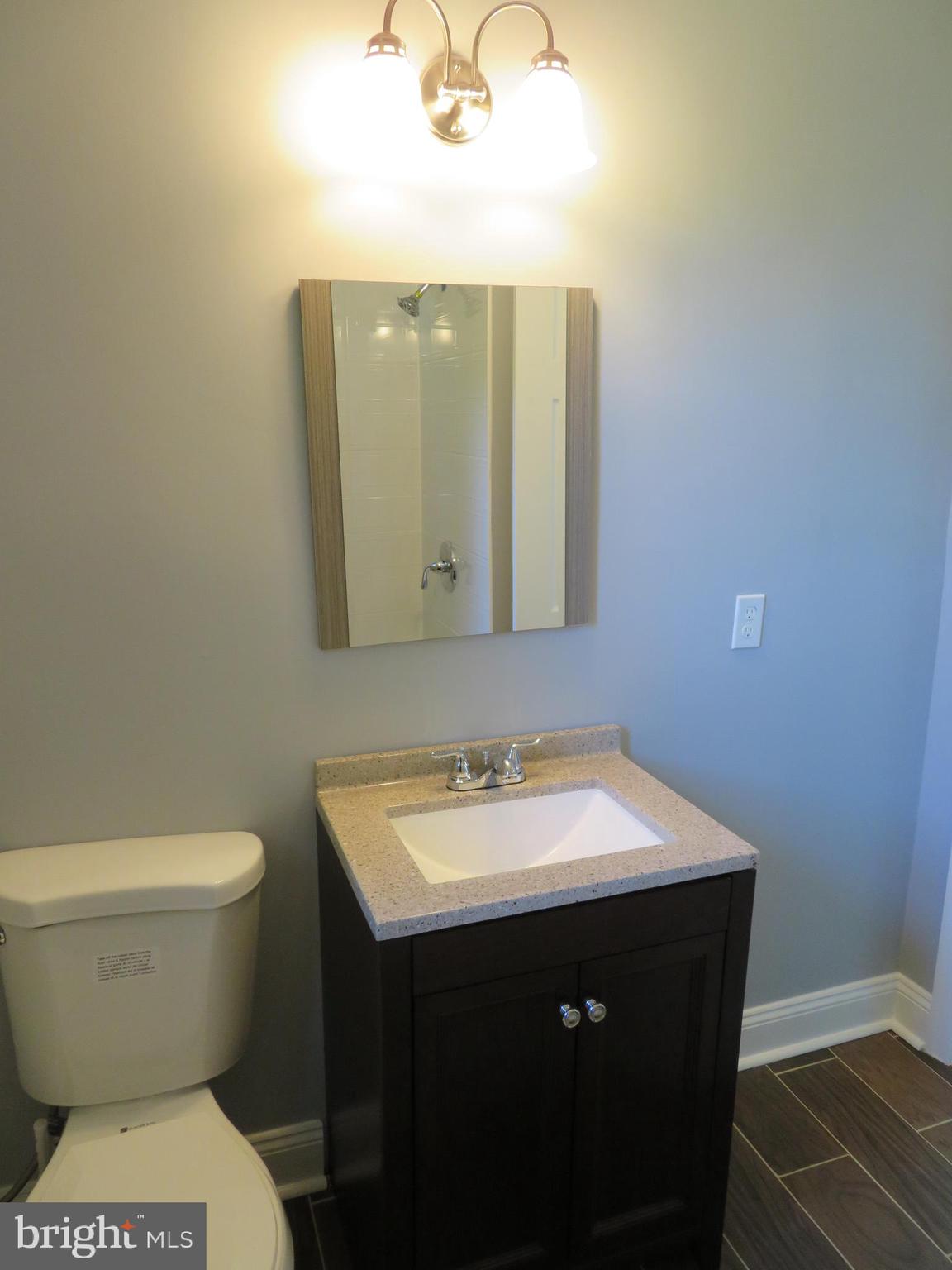 4005 Pimlico Road Baltimore, MD 21215 - Photo 27 of 45 2nd Level Full Bath - Wood Vanity and Mirror