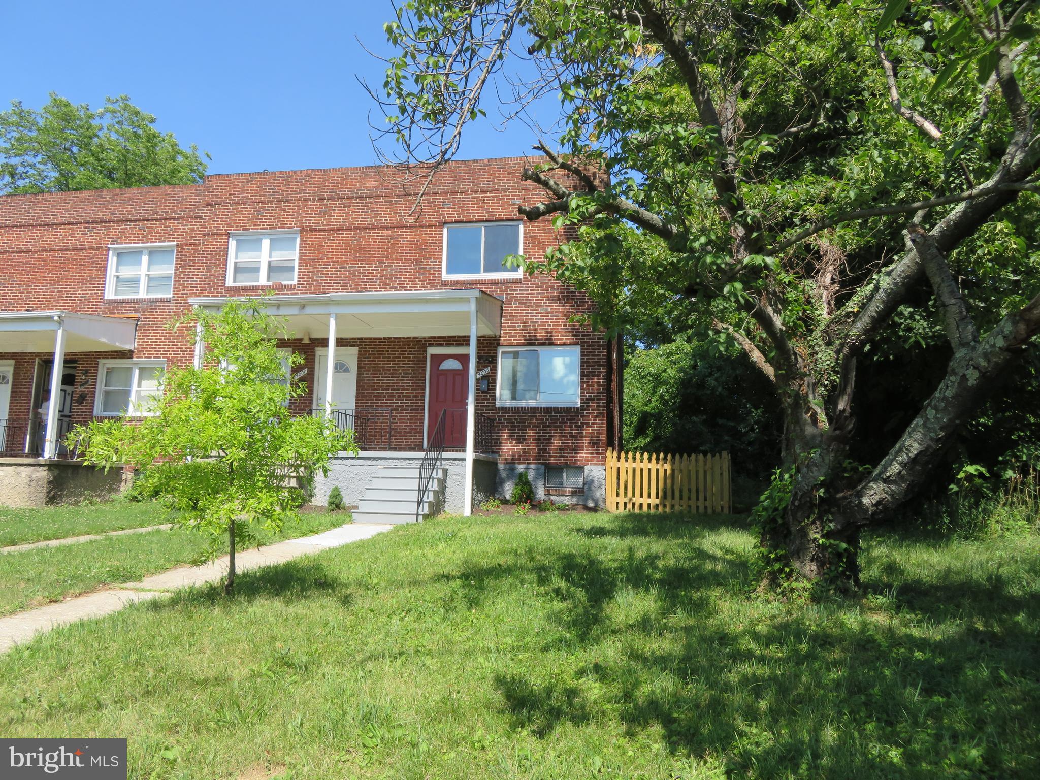 4005 Pimlico Road Baltimore, MD 21215 - Photo 5 of 45 Side View of Home Exterior, Front Porch, and Lawn