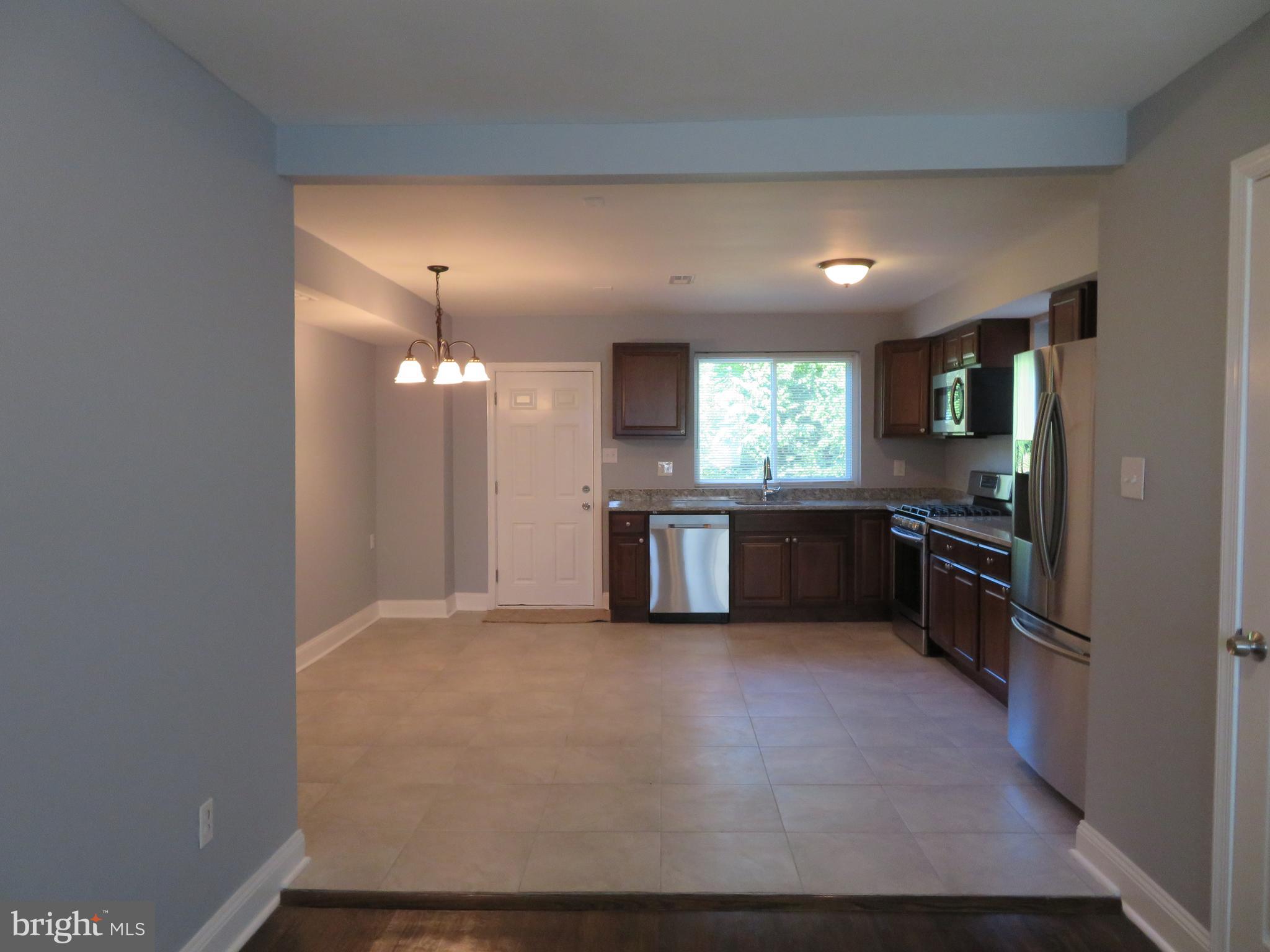 4005 Pimlico Road Baltimore, MD 21215 - Photo 8 of 45 View into Open Kitchen and Dining from Front Door