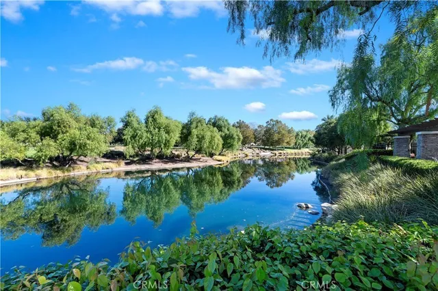 a view of a lake with a house in the background