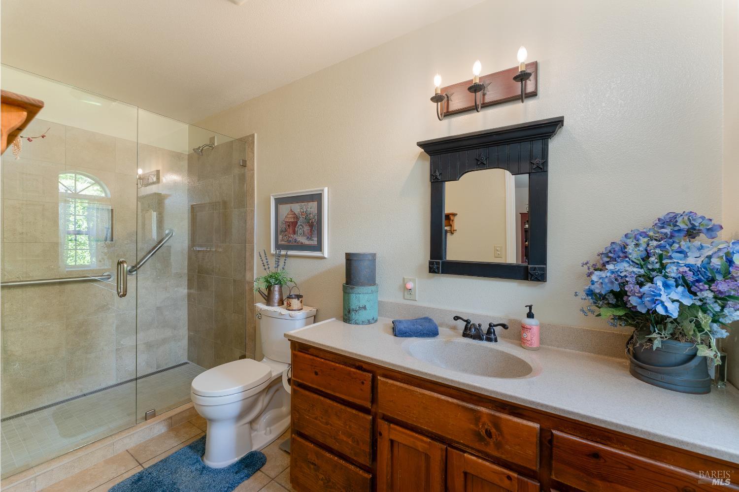 1991 Fern Canyon Road Ukiah, CA 95482 - Photo 17 of 19 a bathroom with a toilet sink and shower