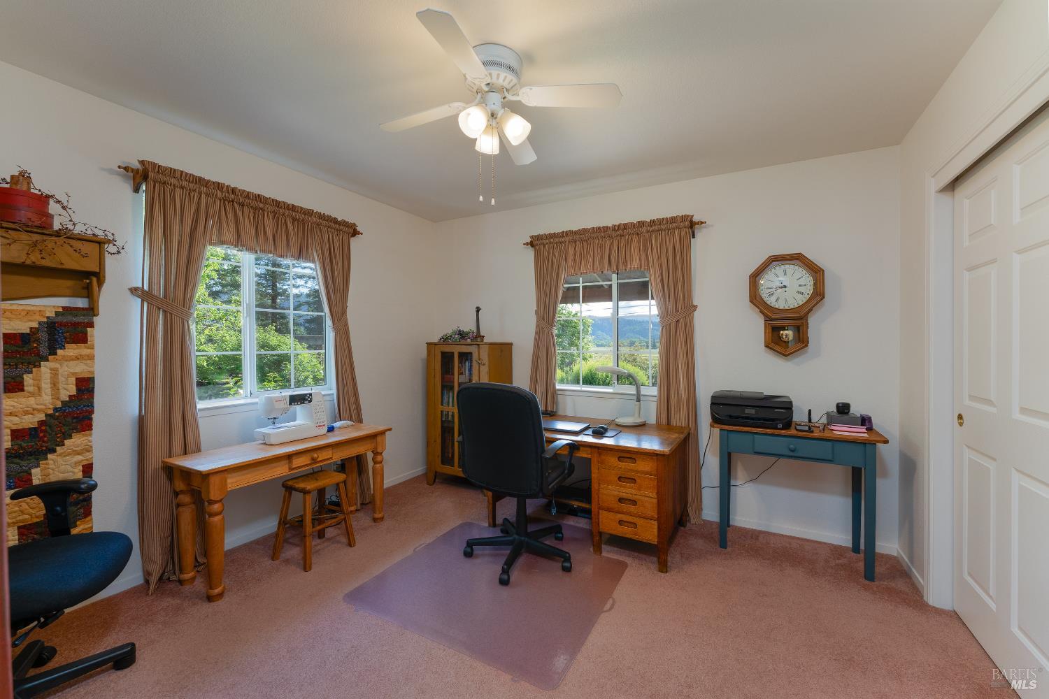 1991 Fern Canyon Road Ukiah, CA 95482 - Photo 18 of 19 a view of a workspace with furniture and a window